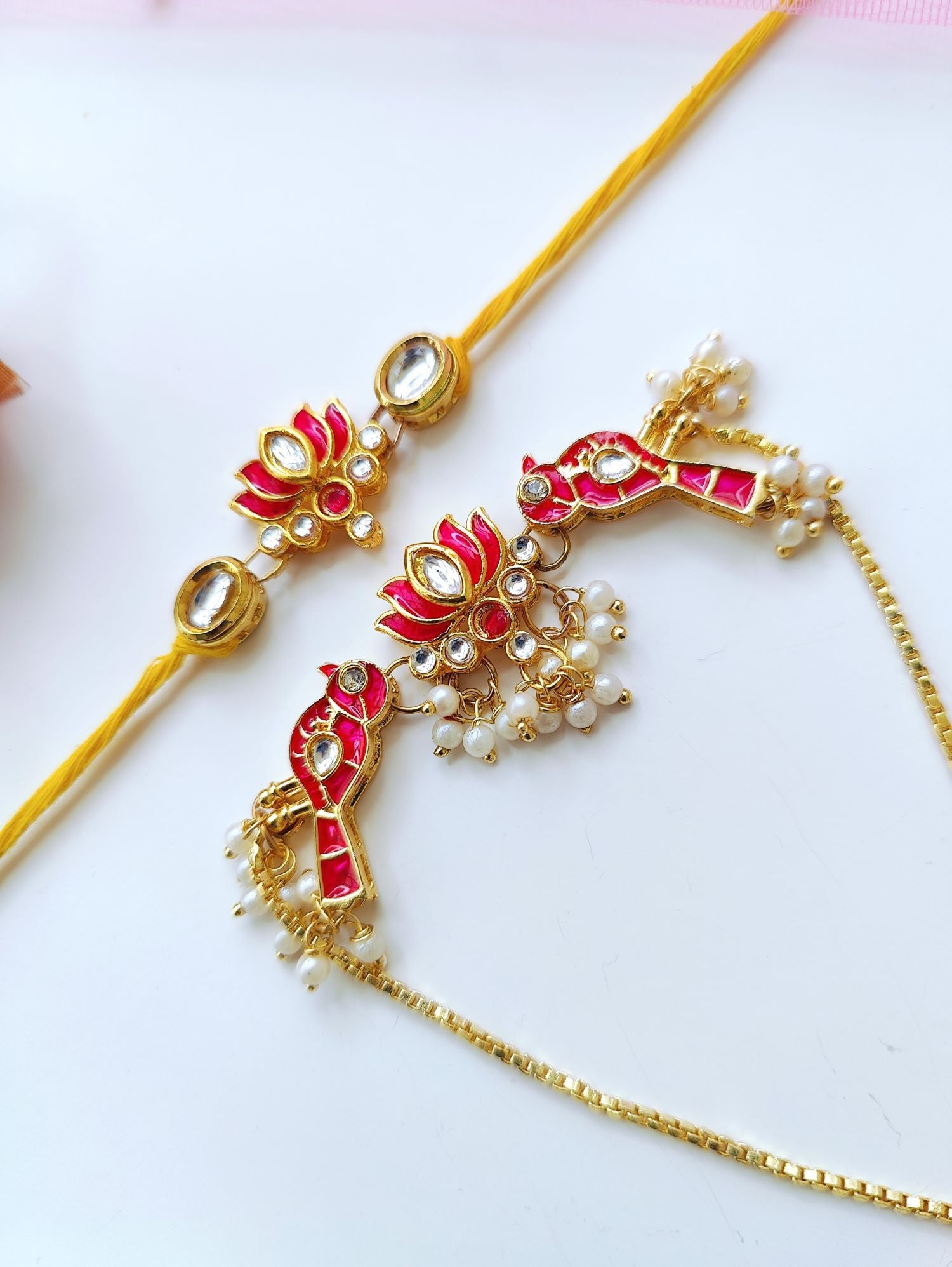 Handmade Bhaiya Bhabhi Rakhi set with lotus design, Kundan stones, pearl beads; traditional rakhi for brother 2026