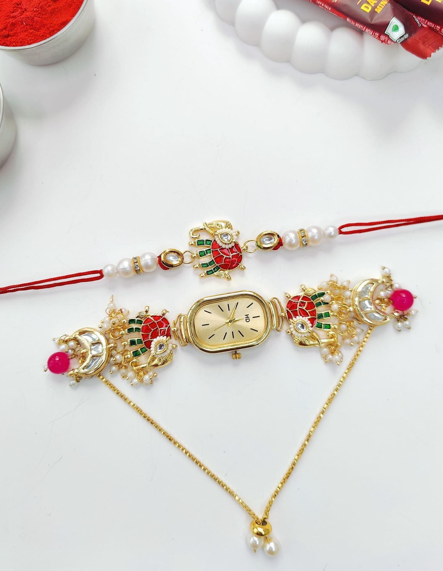 crescent moon rakhi combo set with elephant motif gold bracelet watch