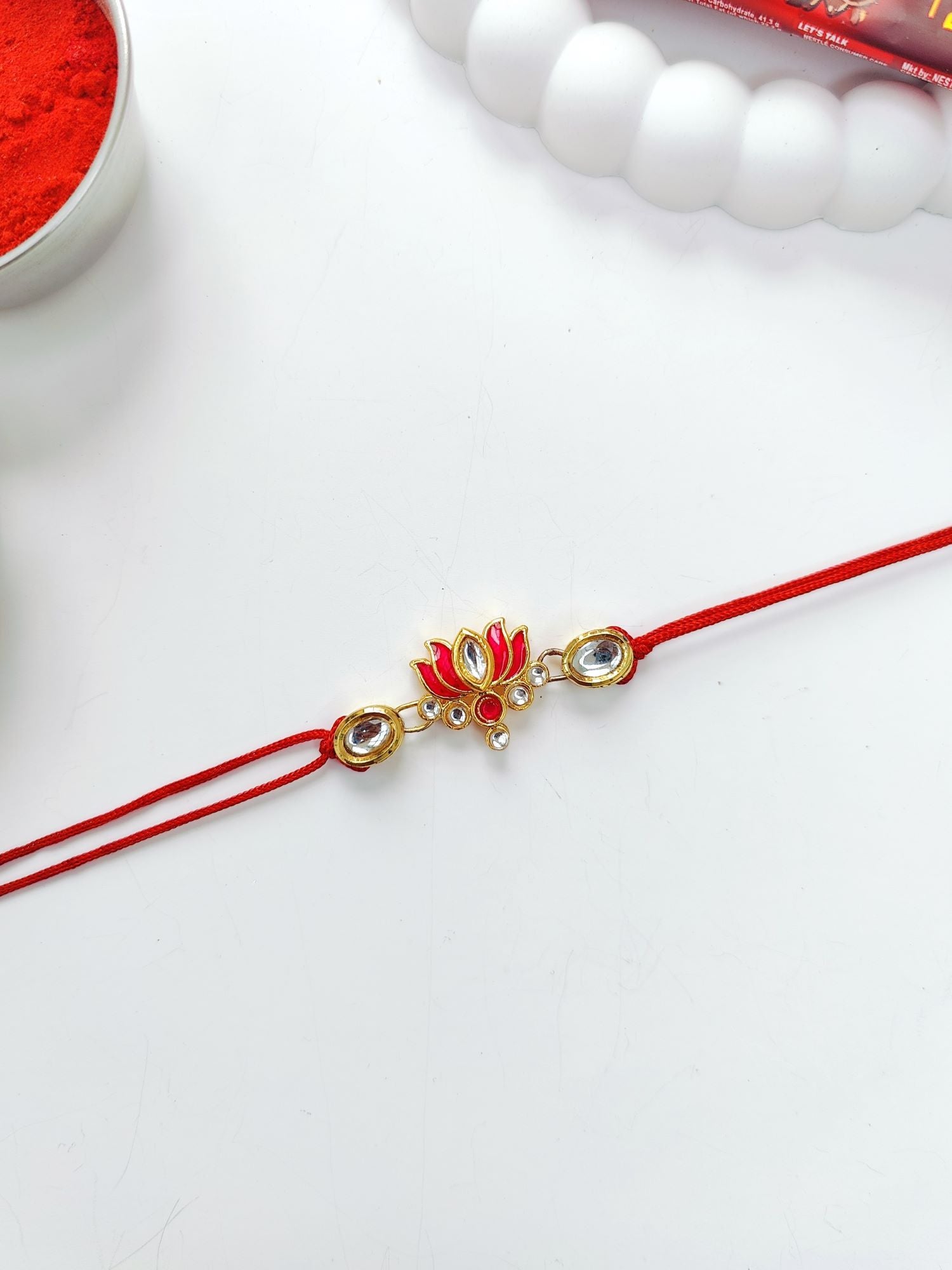 pink lotus rakhi with kundan and Kashmiri watch for bhaiya bhabhi