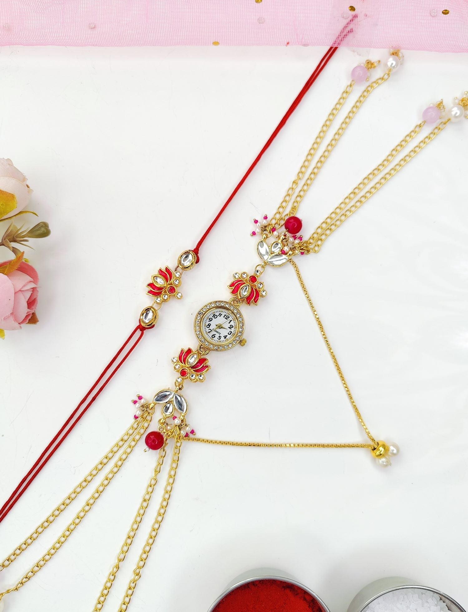pink lotus rakhi with kundan and Kashmiri watch for bhaiya bhabhi