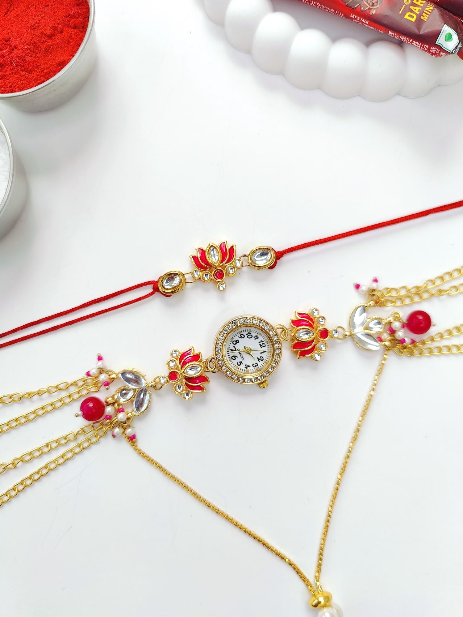 pink lotus rakhi with kundan and Kashmiri watch for bhaiya bhabhi