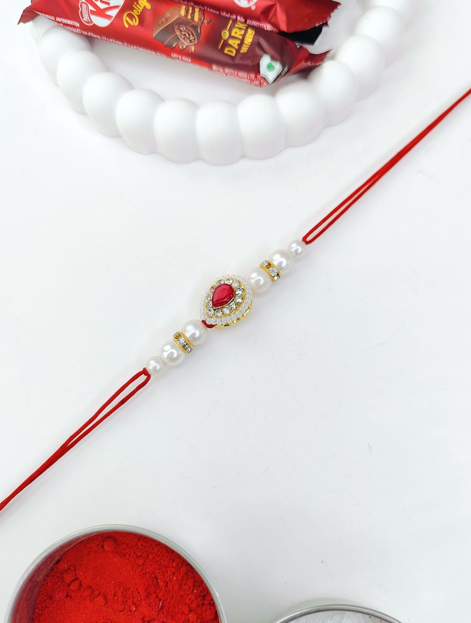 rich pink handmade bhaiya bhabhi rakhi set with kundan beads 2026