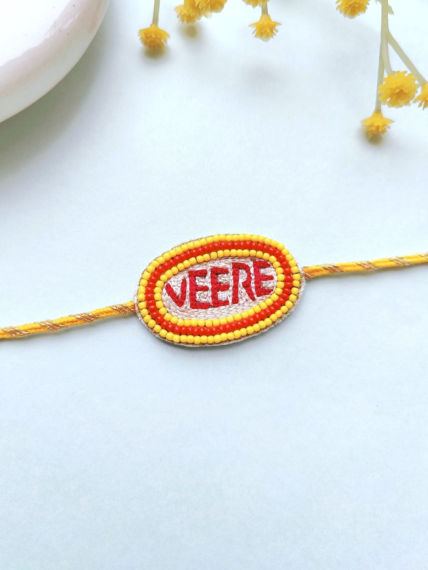 Multicolored, adjustable, handmade beaded Rakhi for kids ideal for Raksha Bandhan celebration, package includes 1 Rakhi with Roli and Chawal