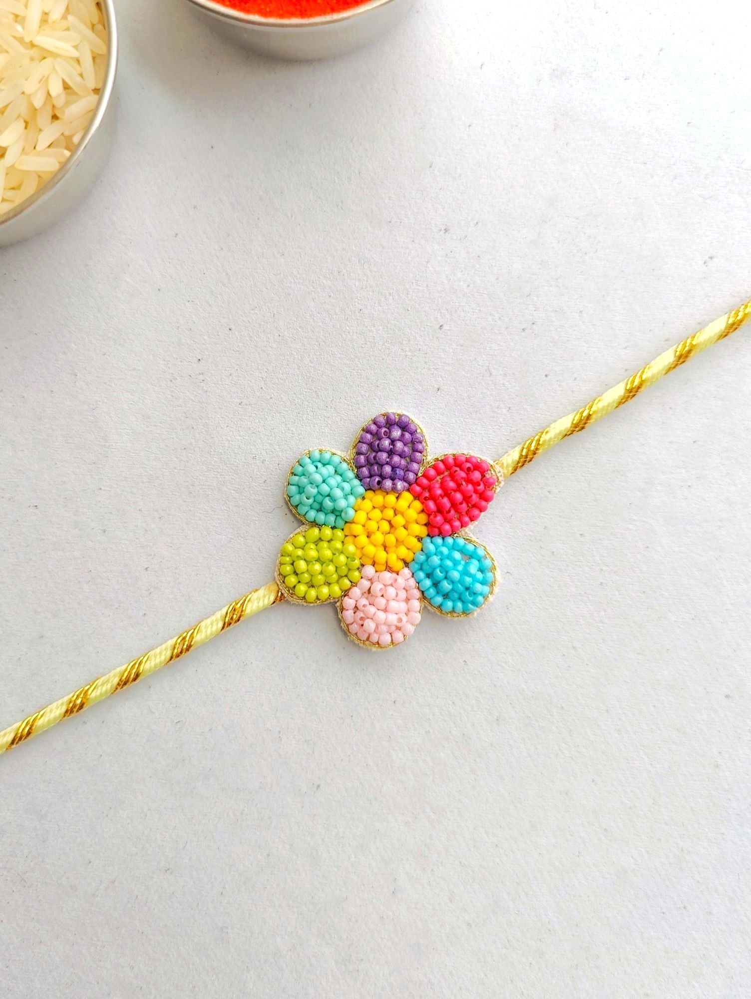 Handmade multicolored Flower Rakhi in Bulk, adjustable and beaded, ideal for festive occasions