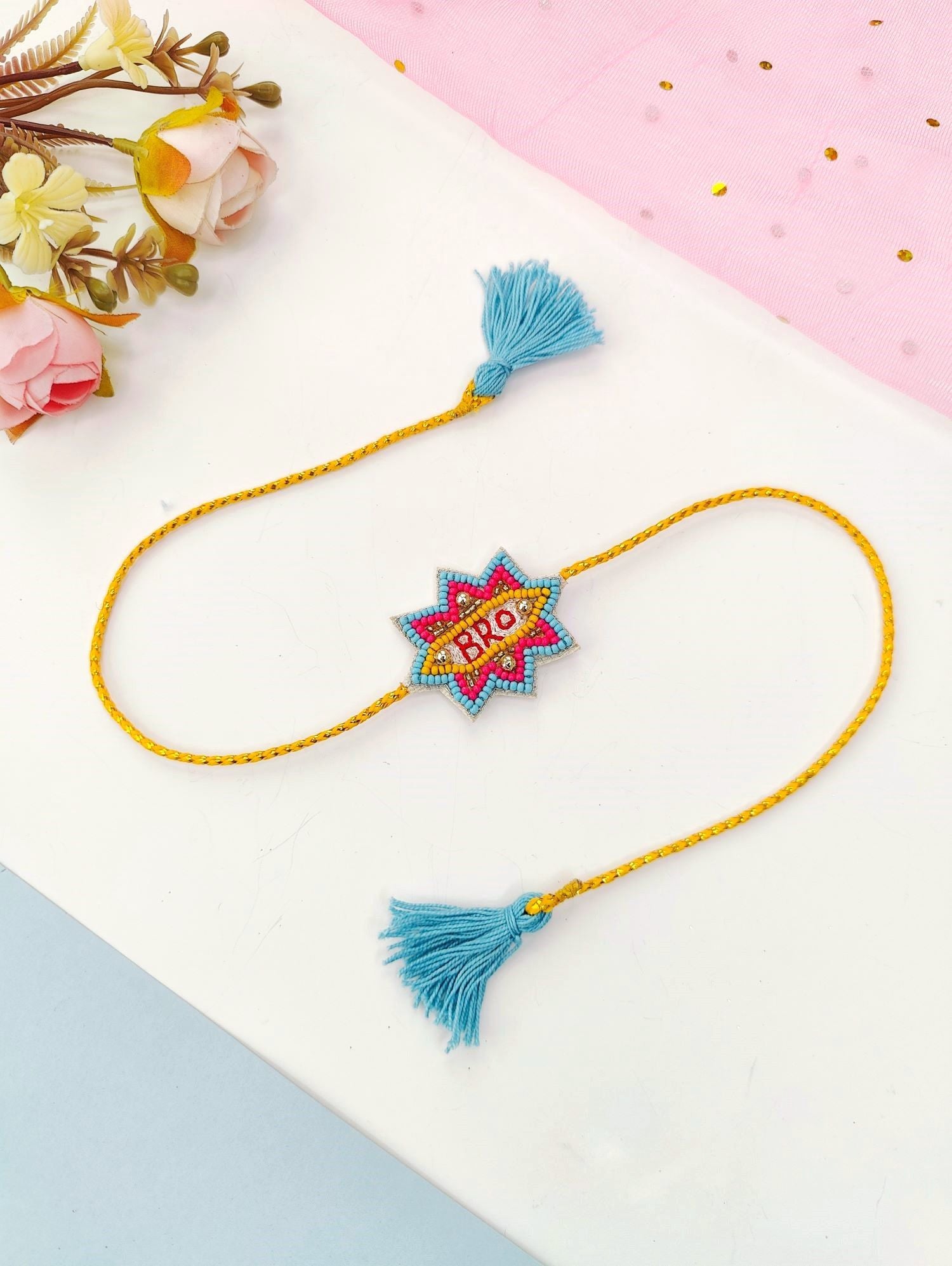 handmade blue and yellow bro rakhi, unique kids rakhi 2026 design