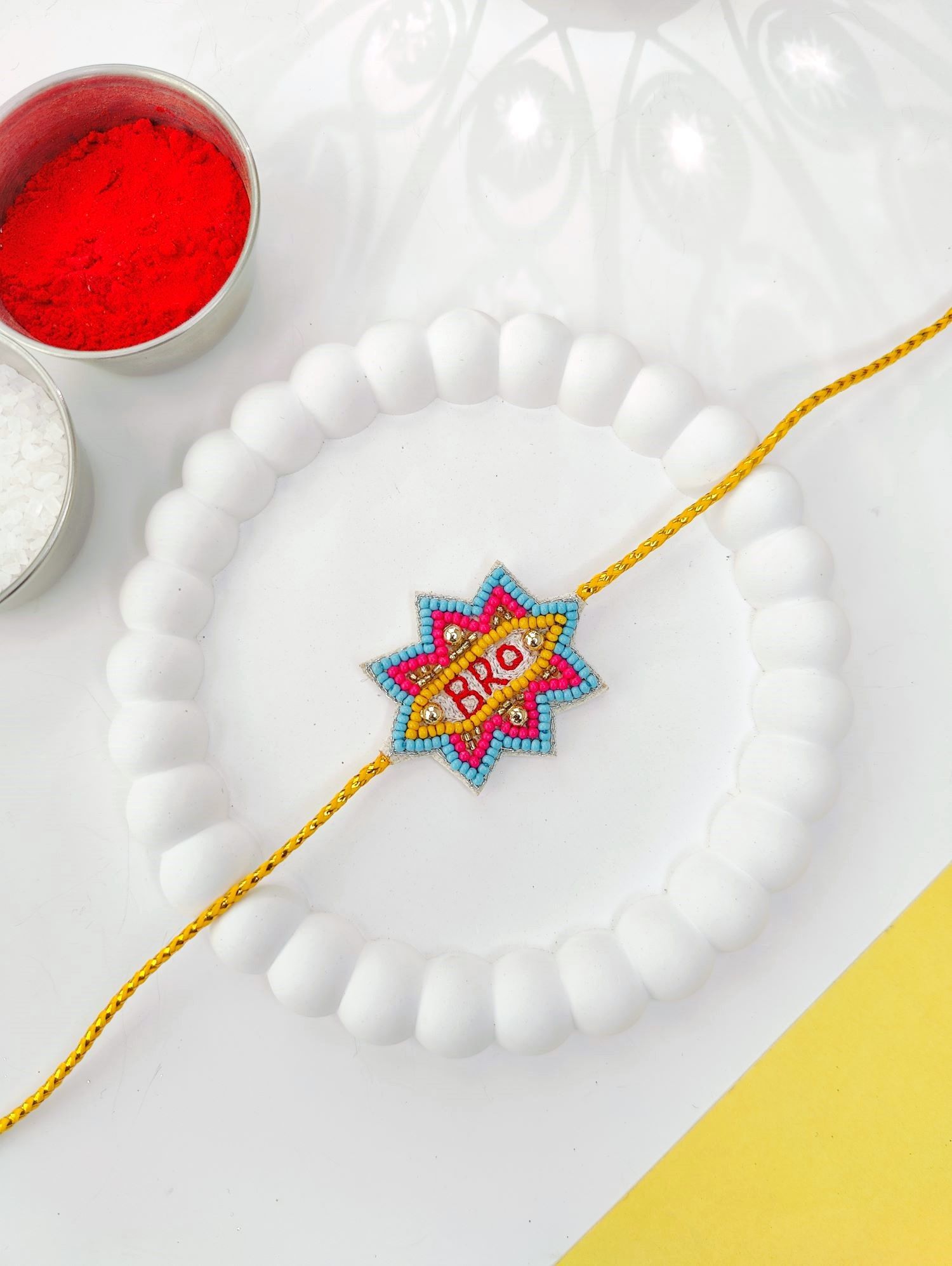 handmade blue and yellow bro rakhi, unique kids rakhi 2026 design