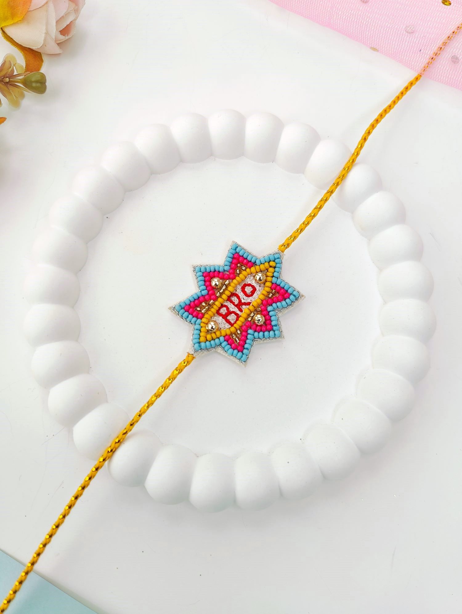 handmade blue and yellow bro rakhi, unique kids rakhi 2026 design