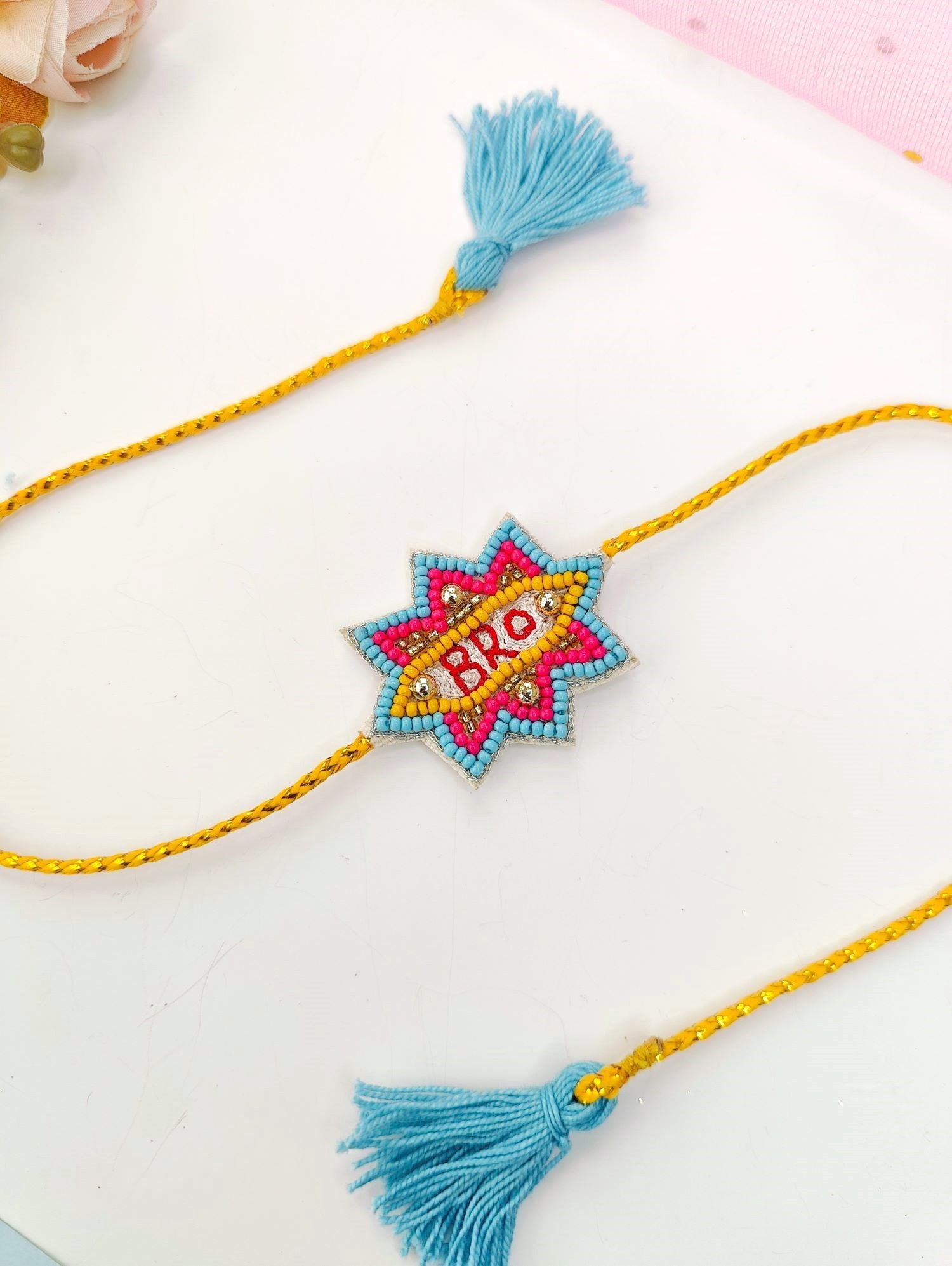 handmade blue and yellow bro rakhi, unique kids rakhi 2026 design