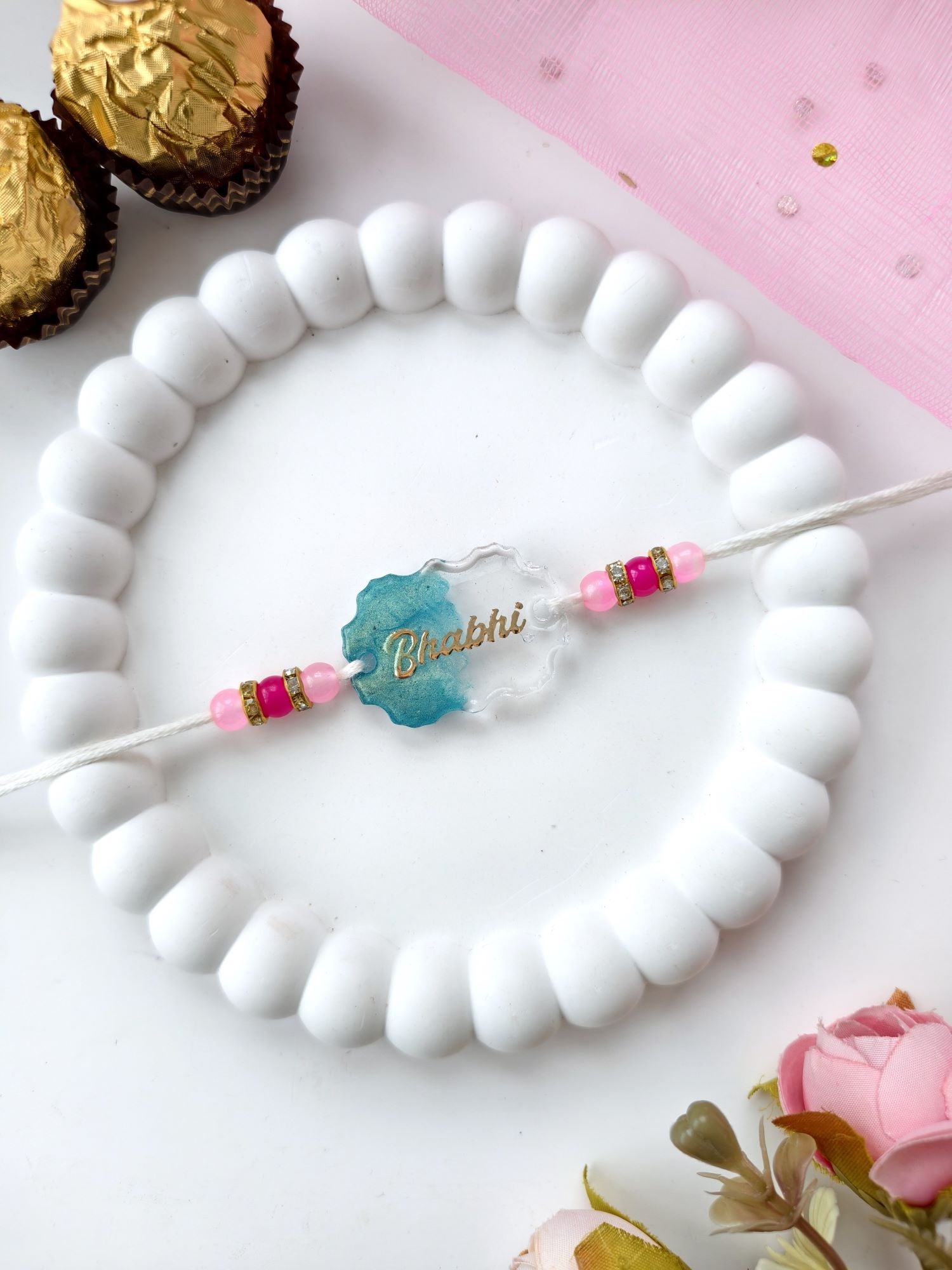 handmade resin rakhi with pearl beads, best rakhi for brother 2026