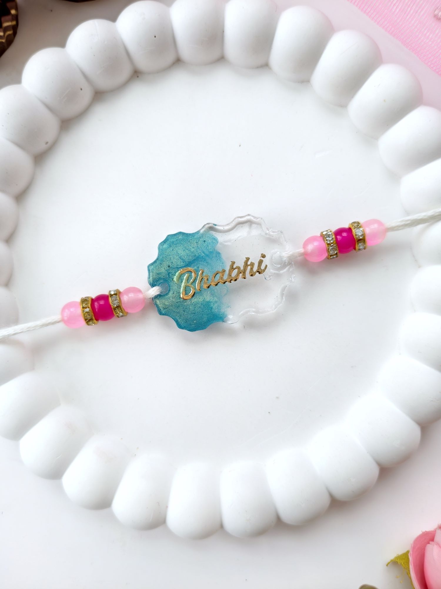 handmade resin rakhi with pearl beads, best rakhi for brother 2026