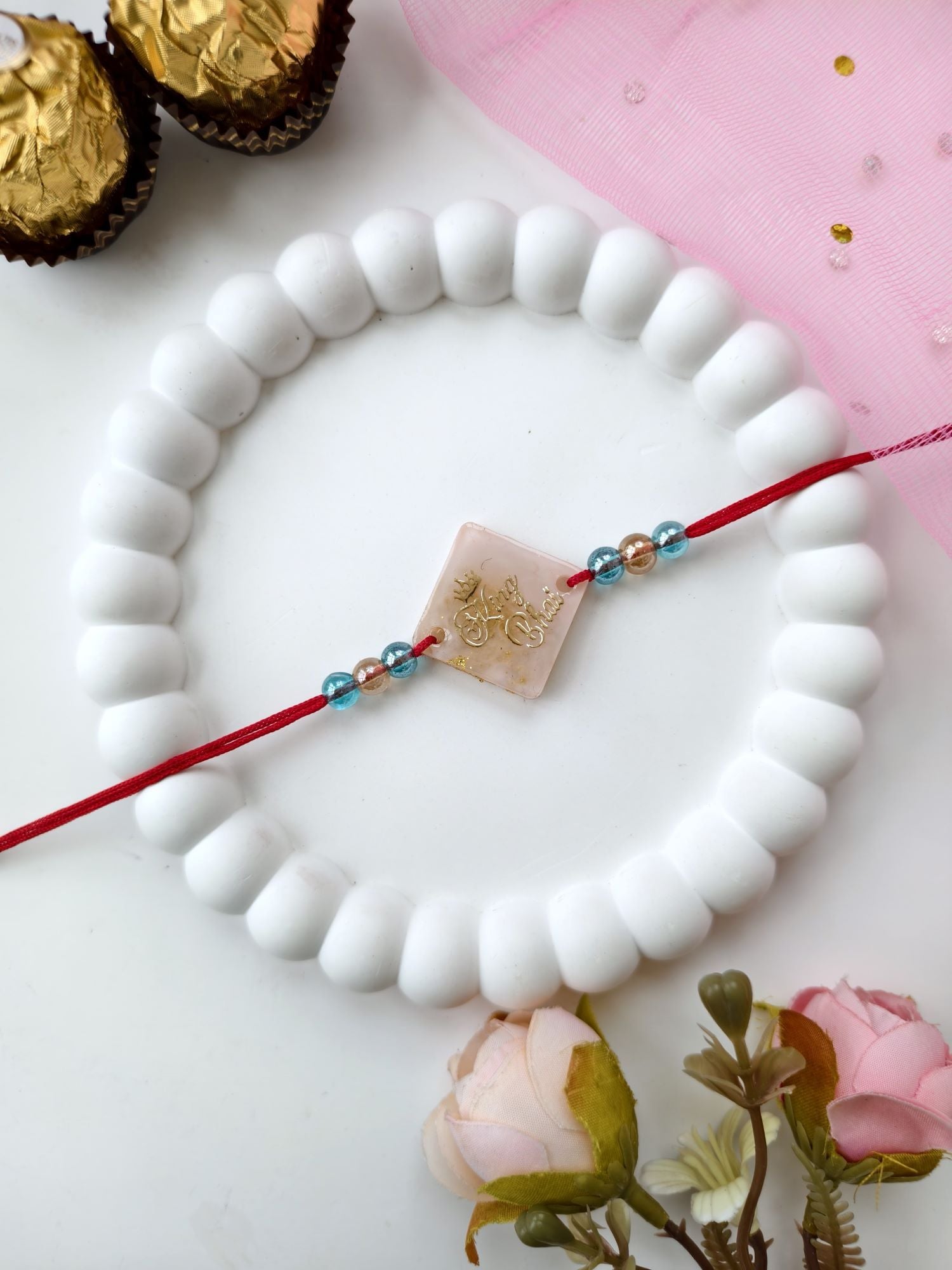 handmade resin rakhi king bhai design with pearl bead for brother