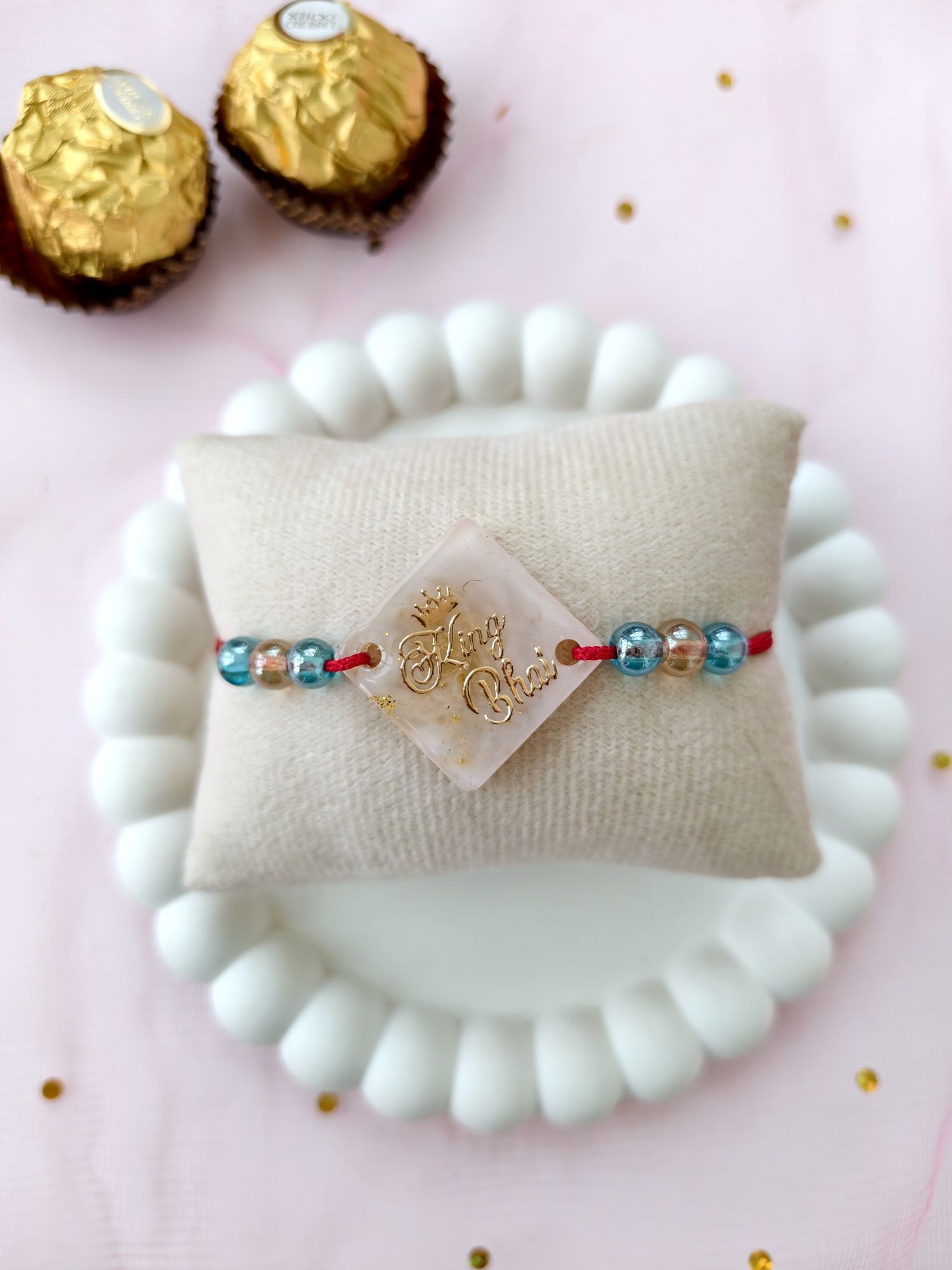 handmade resin rakhi king bhai design with pearl bead for brother