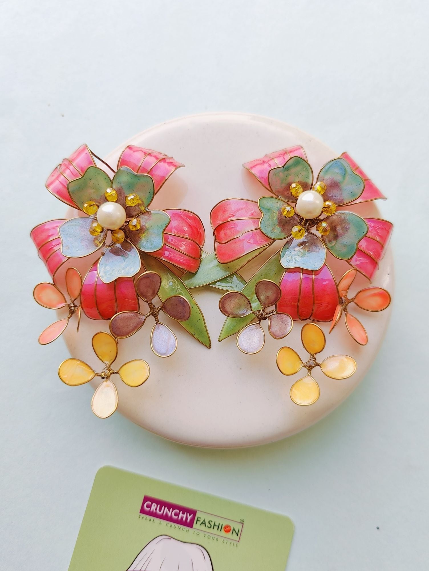 Colorful drop & dangler earrings featuring floral resin art, perfect for Haldi gatherings on any Shopify store.