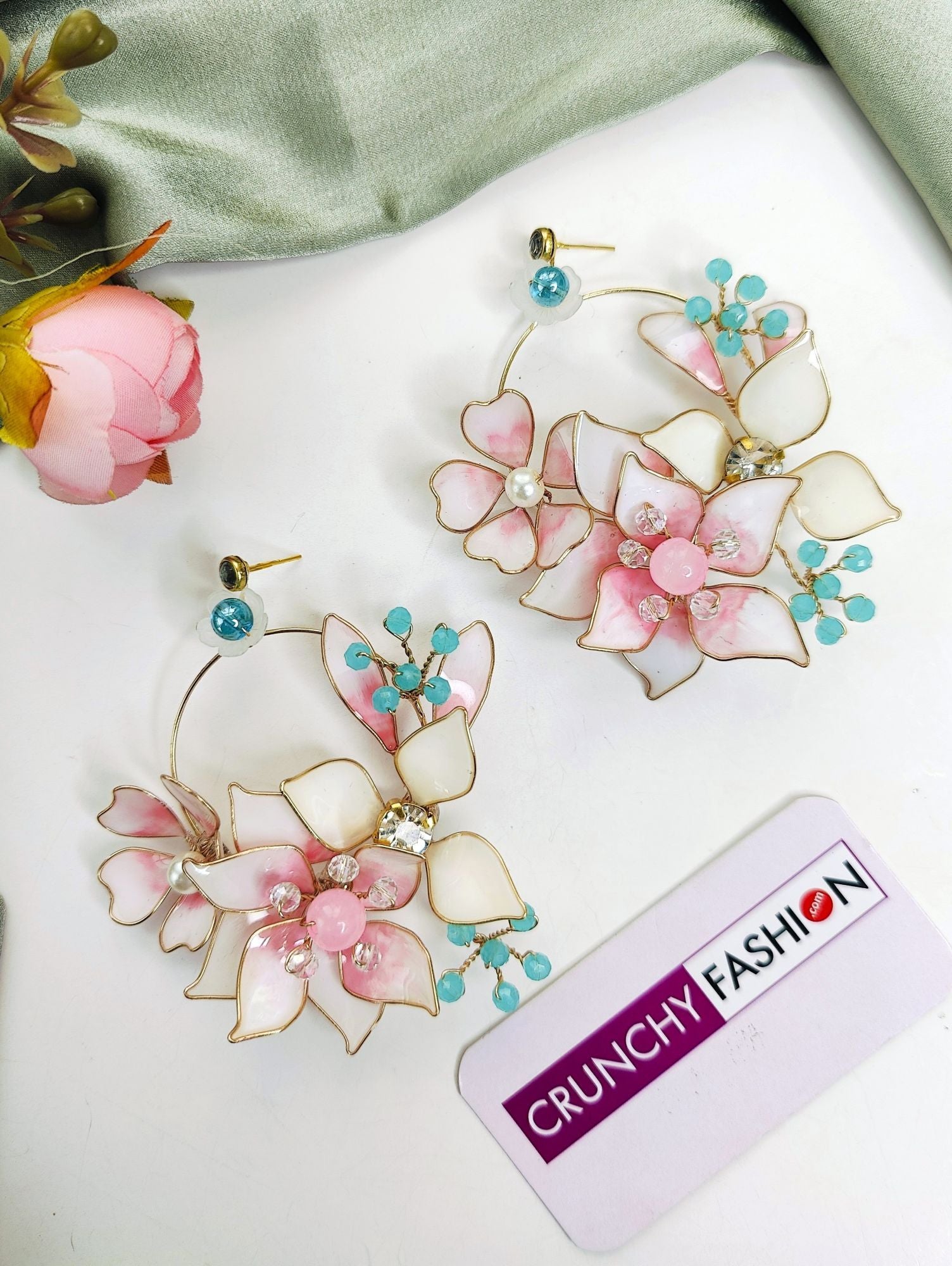 Floral resin droplet earrings in pink and white, ideal for Haldi carnivals, with fish hook fixation