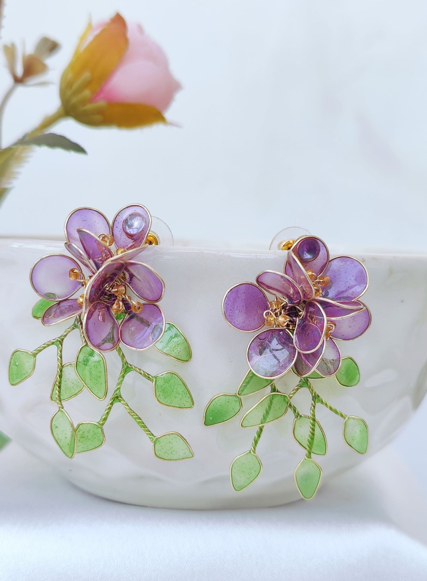 Purple floral resin earrings with green leaves, lightweight studs