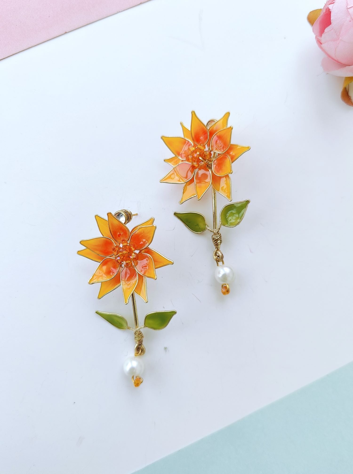 Orange floral resin earrings, sunflower style handmade drop studs