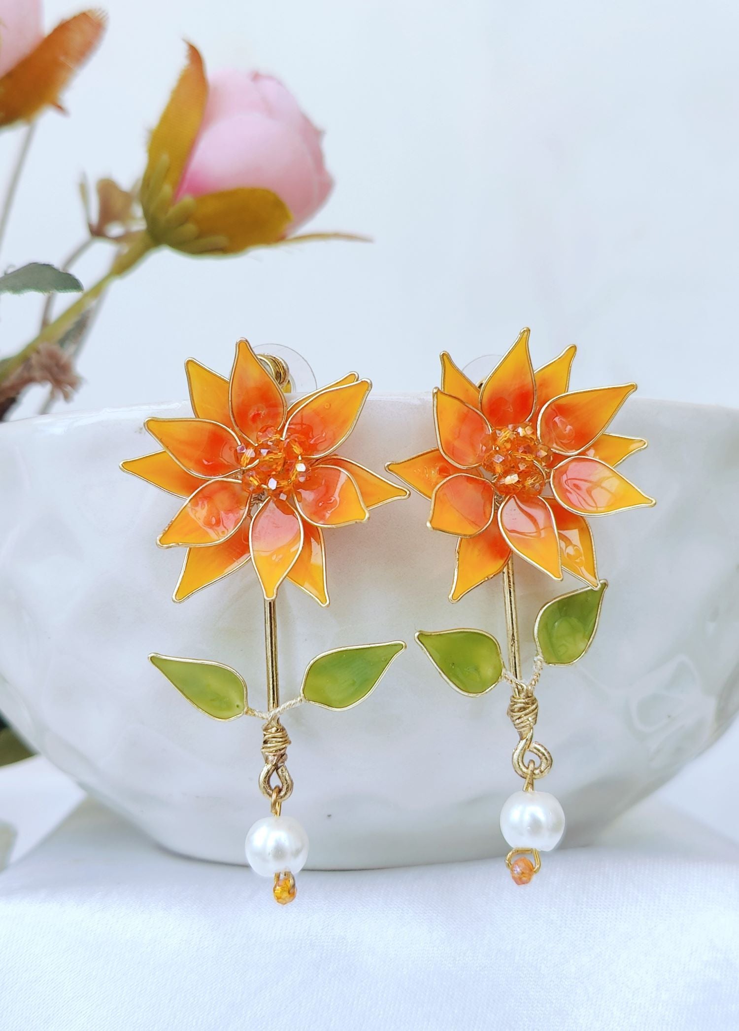 Orange floral resin earrings, sunflower style handmade drop studs