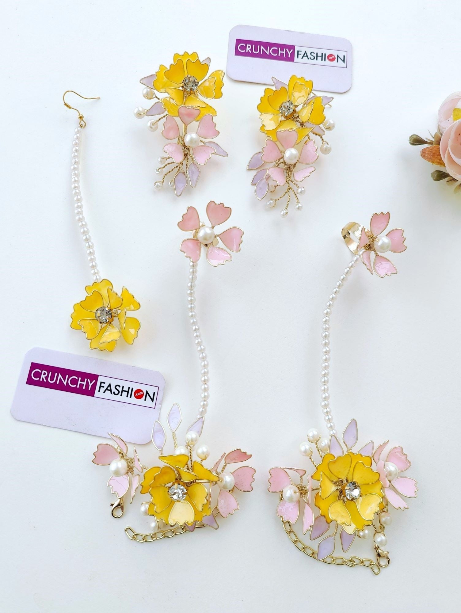 Handmade resin Carnival jewellery set with yellow and baby pink floral design, ideal for brides at haldi and mehndi 