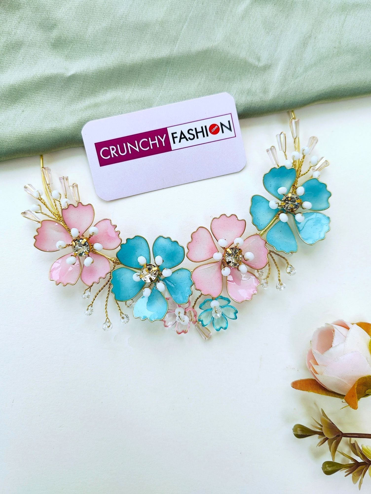 Handcrafted sky-blue resin floral jewelry set for women's haldi or mehndi, gold-plated with beaded details.