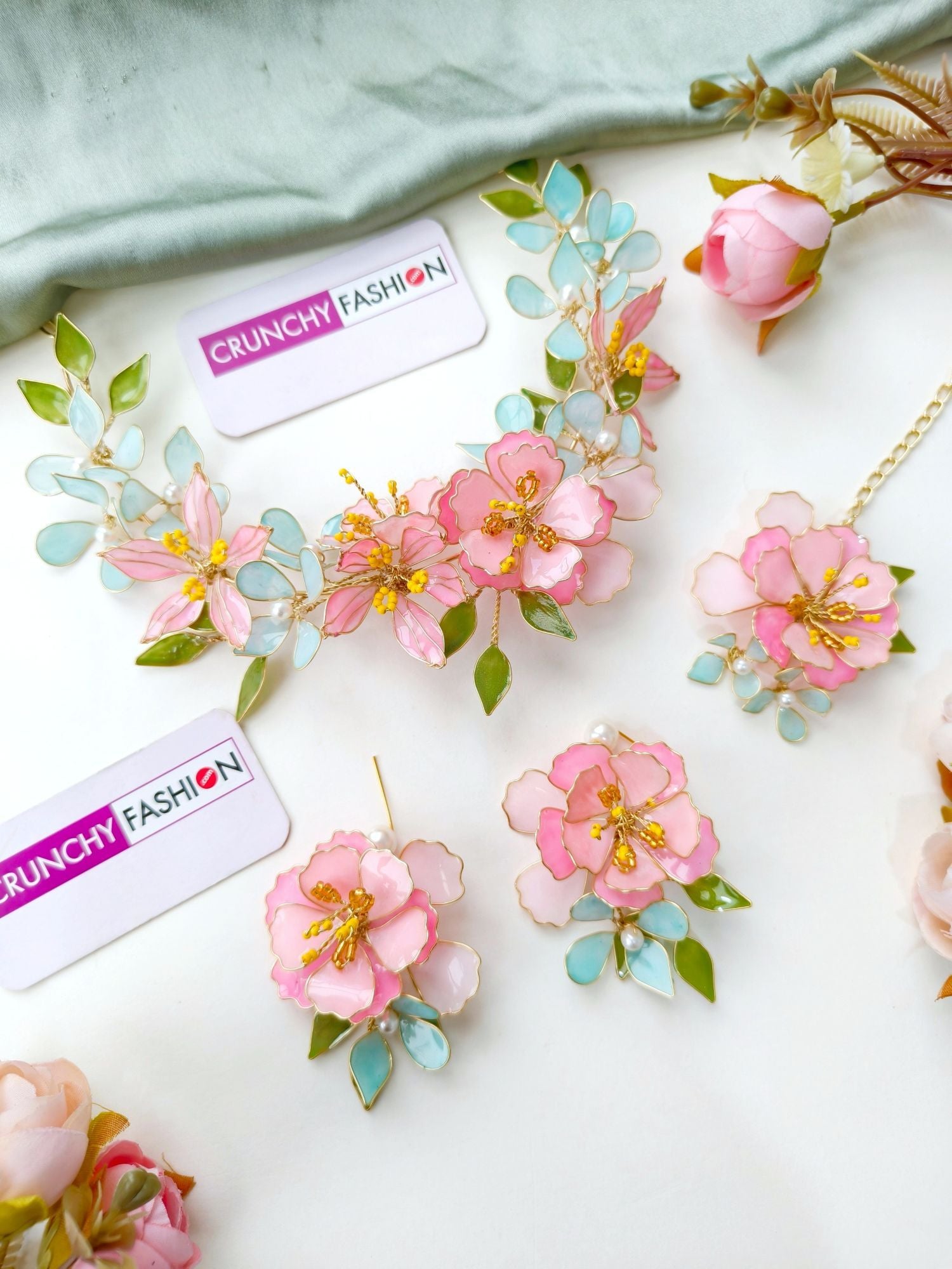 Handmade pastel pink comma powder blue floral resin jewellery with gold plating for brides at haldi & mehndi.