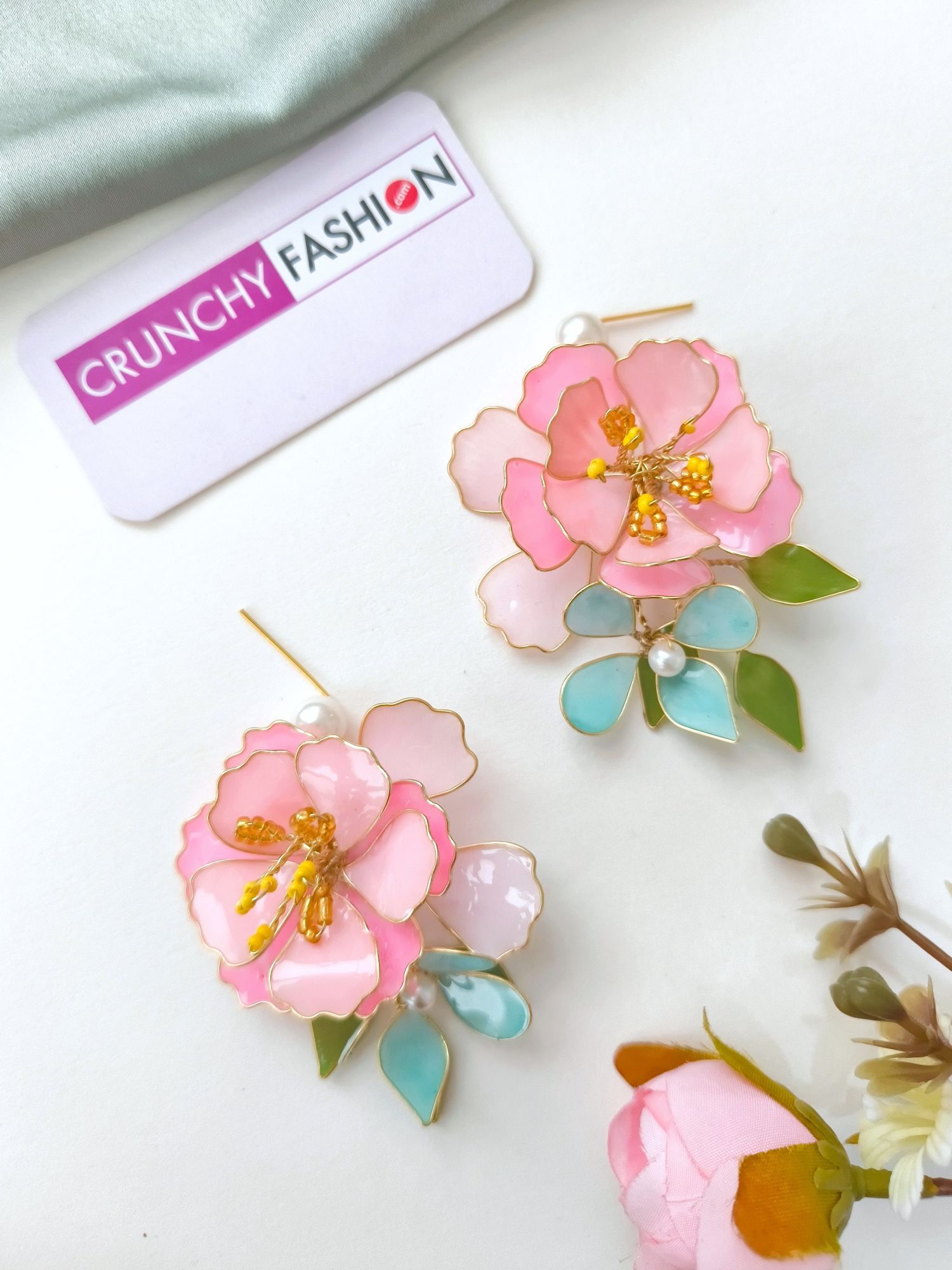 Handmade pastel pink comma powder blue floral resin jewellery with gold plating for brides at haldi & mehndi.