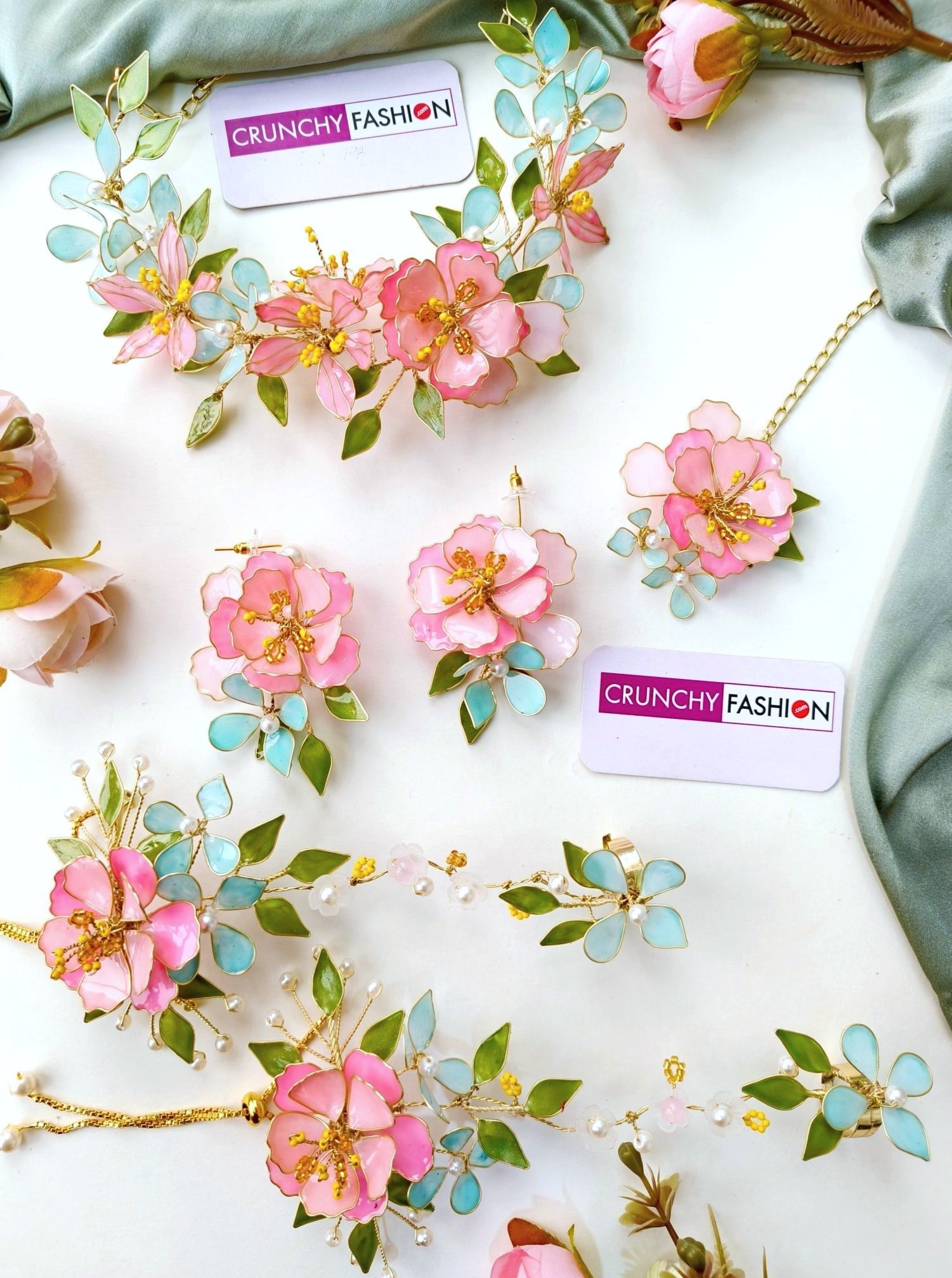 Handmade pastel pink comma powder blue floral resin jewellery with gold plating for brides at haldi & mehndi.