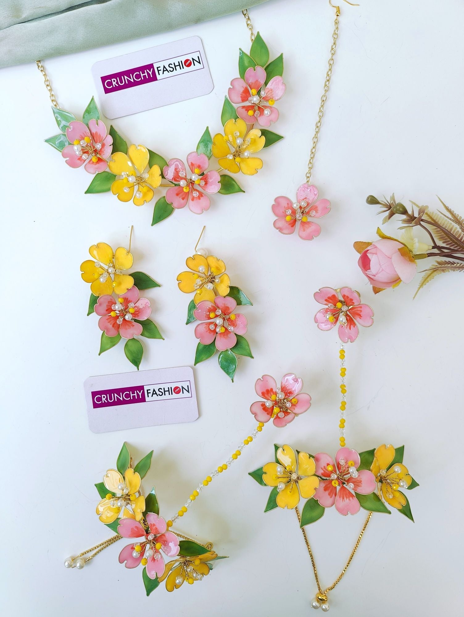 Pastel pink-yellow floral bridal haldi jewellery set for brides