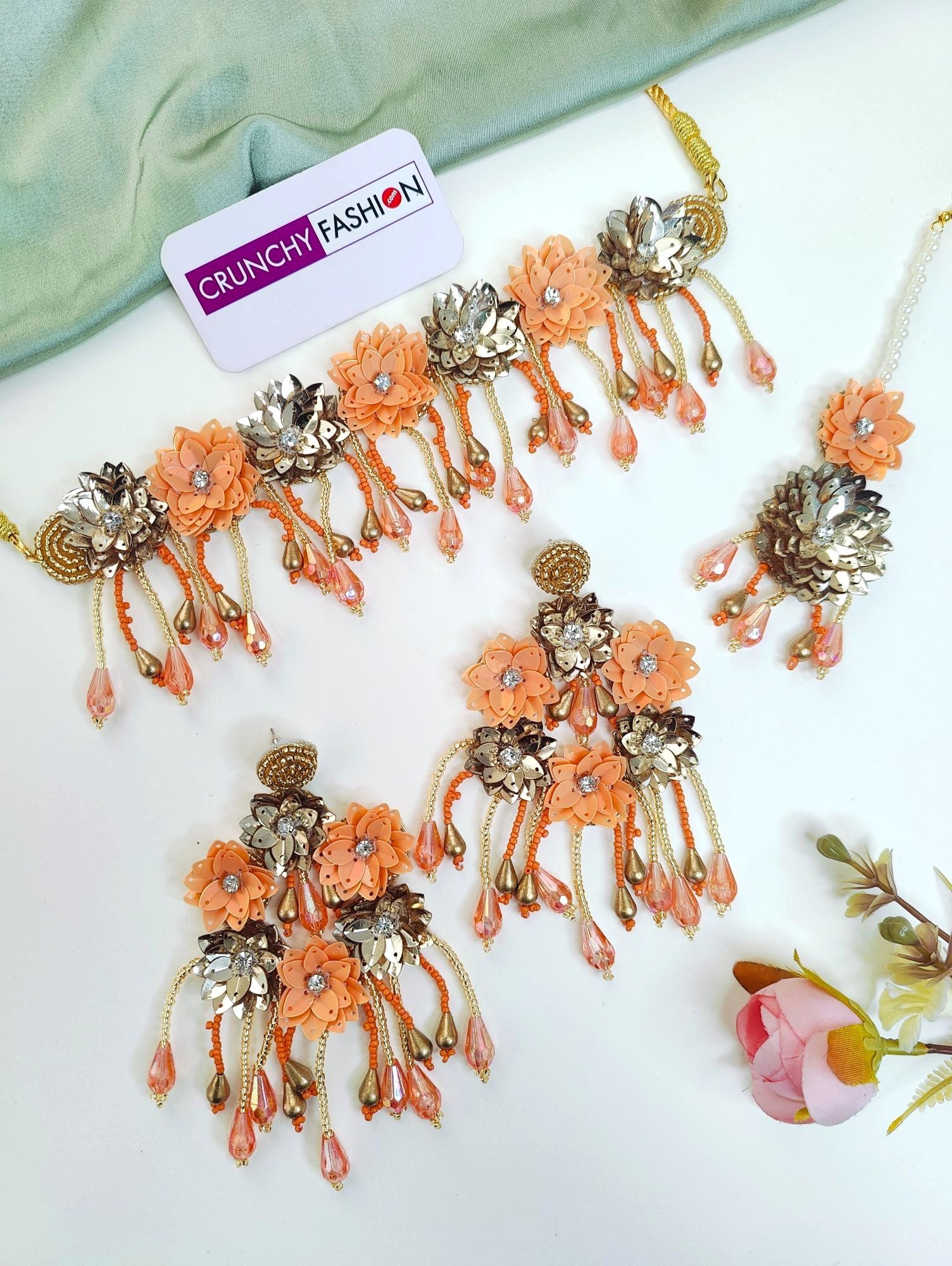 New, handmade Haldi-Mehndi floral jewellery set, with orange multi coloured necklace, earrings, and bracelet ideal for women and girls during festivals, parties or weddings.