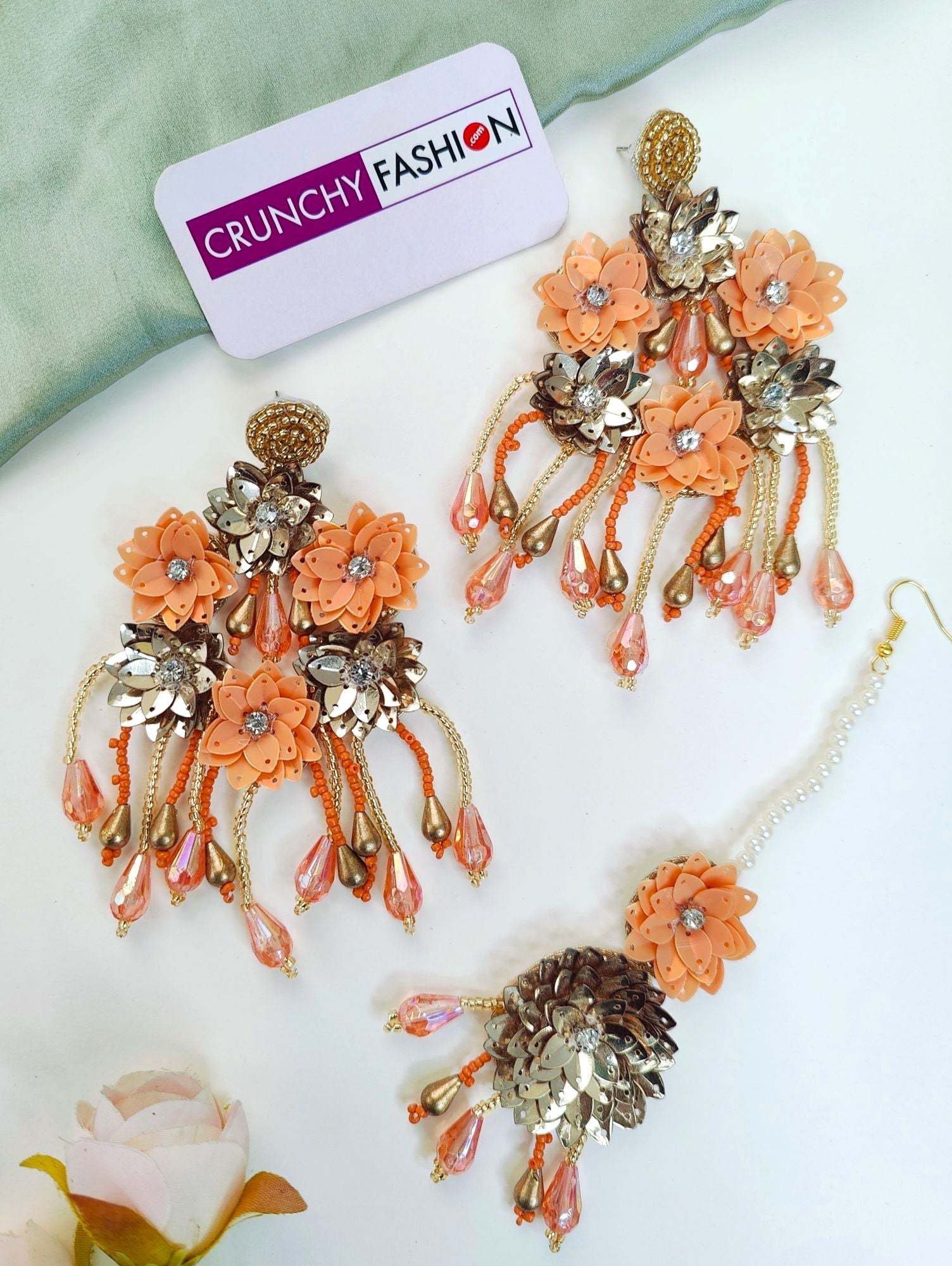 New, handmade Haldi-Mehndi floral jewellery set, with orange multi coloured necklace, earrings, and bracelet ideal for women and girls during festivals, parties or weddings.