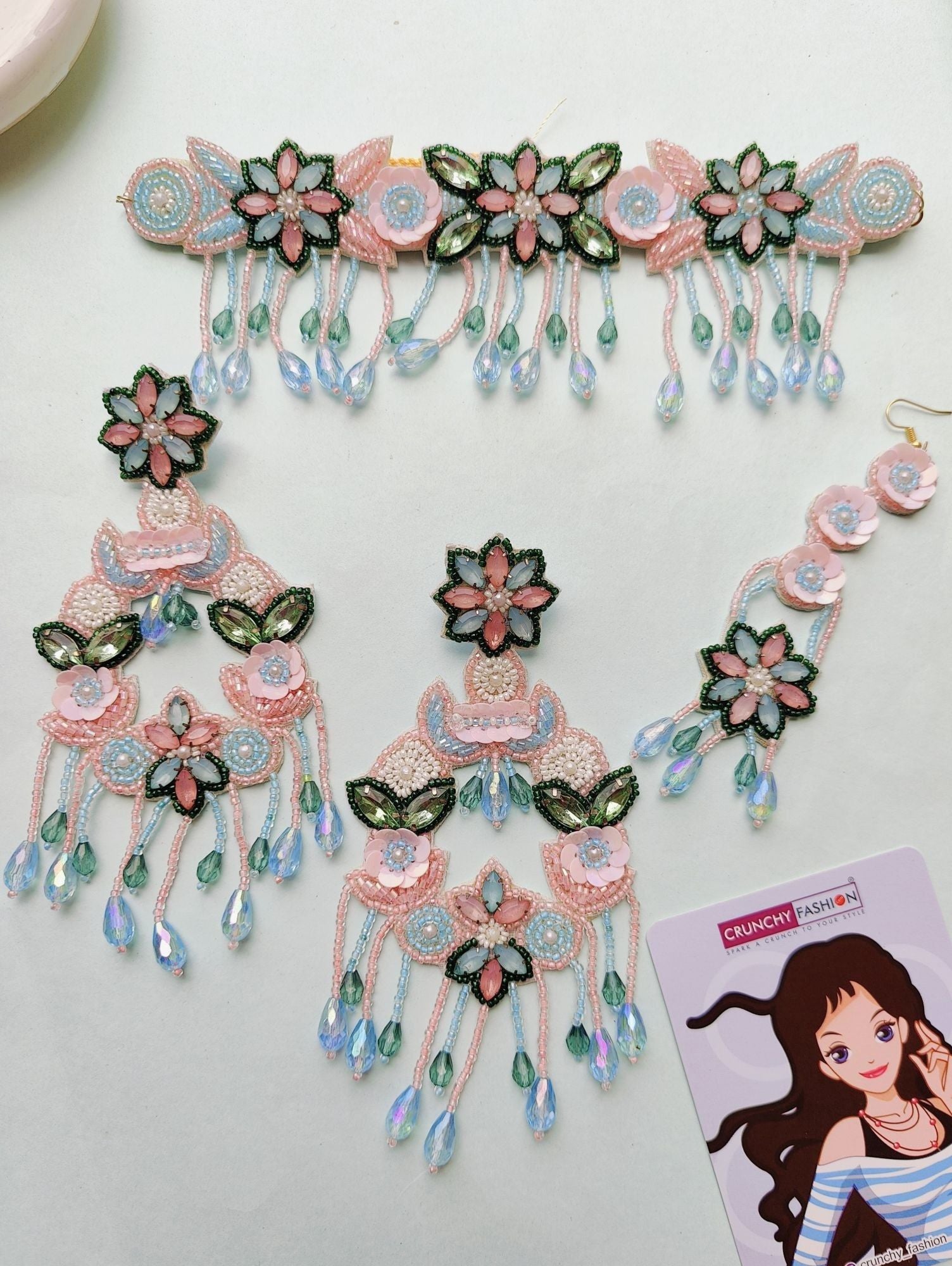 Handcrafted pink, sky blue, and green floral jewellery set for haldi ceremony, perfect for brides