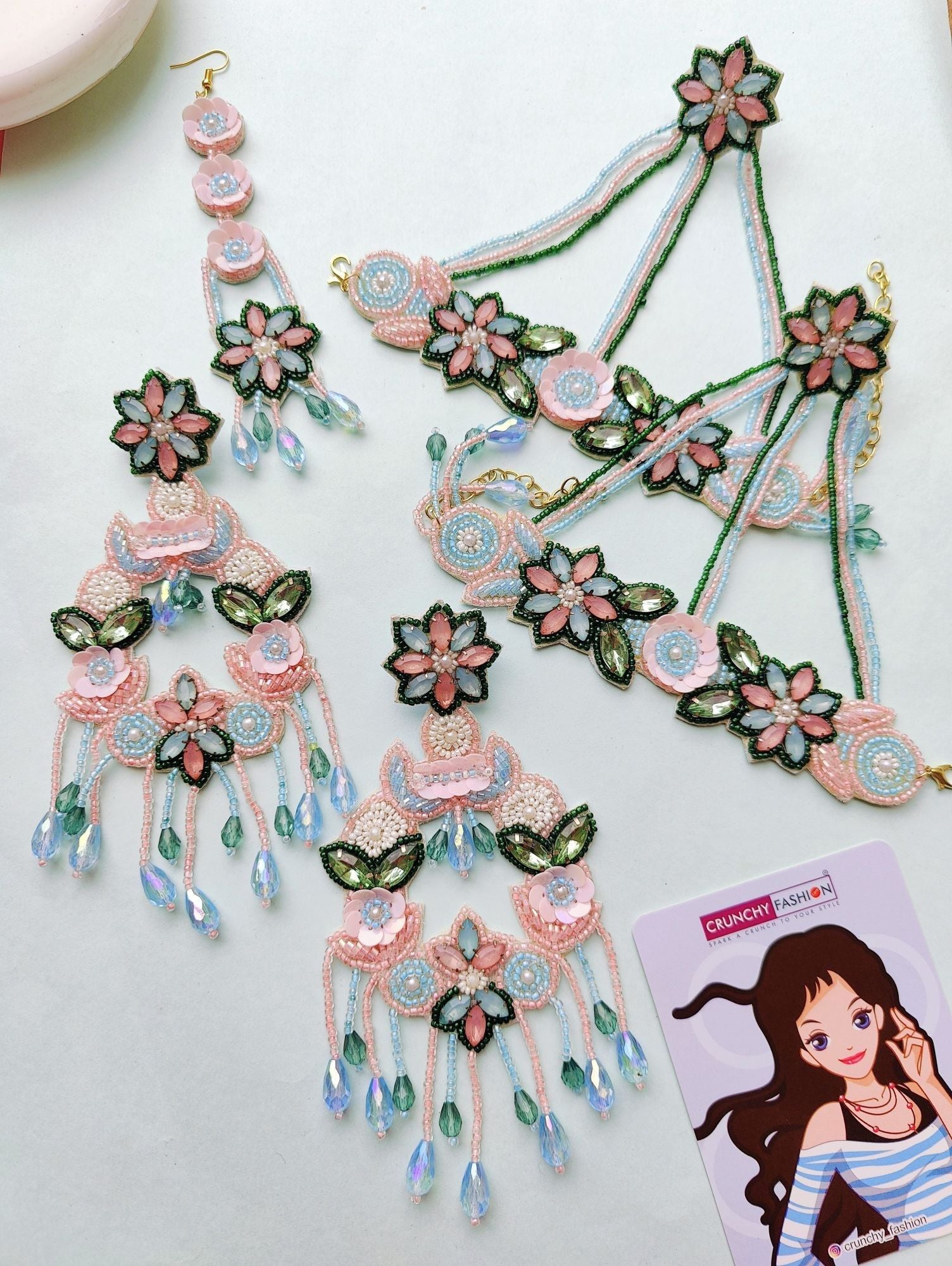 Handcrafted pink, sky blue, and green floral jewellery set for haldi ceremony, perfect for brides