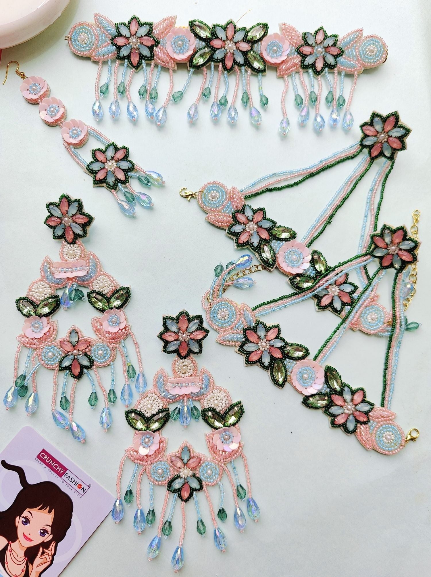 Handcrafted pink, sky blue, and green floral jewellery set for haldi ceremony, perfect for brides