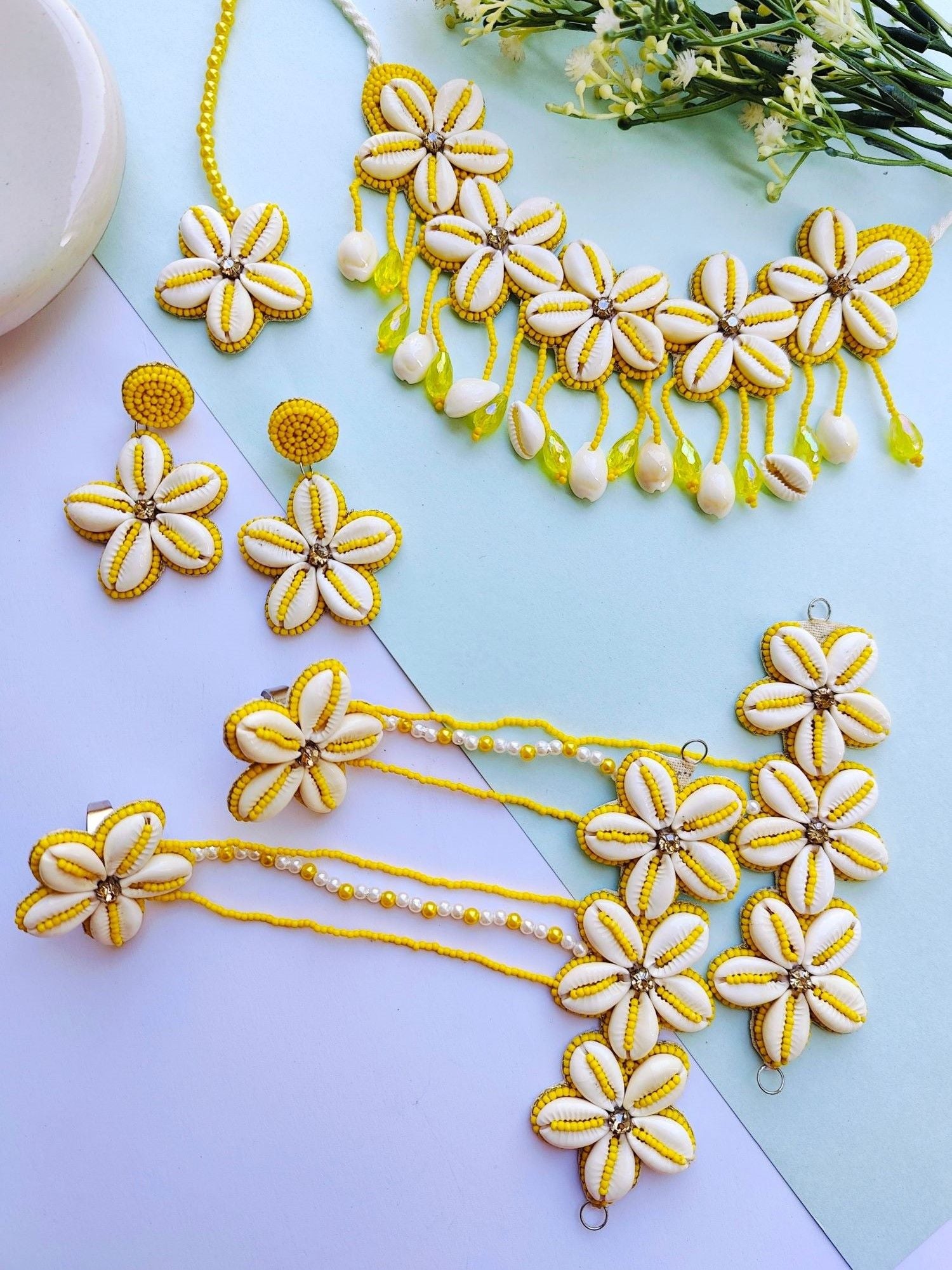 Handmade yellow beaded cowrie Haldi Mehndi bridal jewellery set ideal for women weddings, featuring floral theme and made from handicraft collection