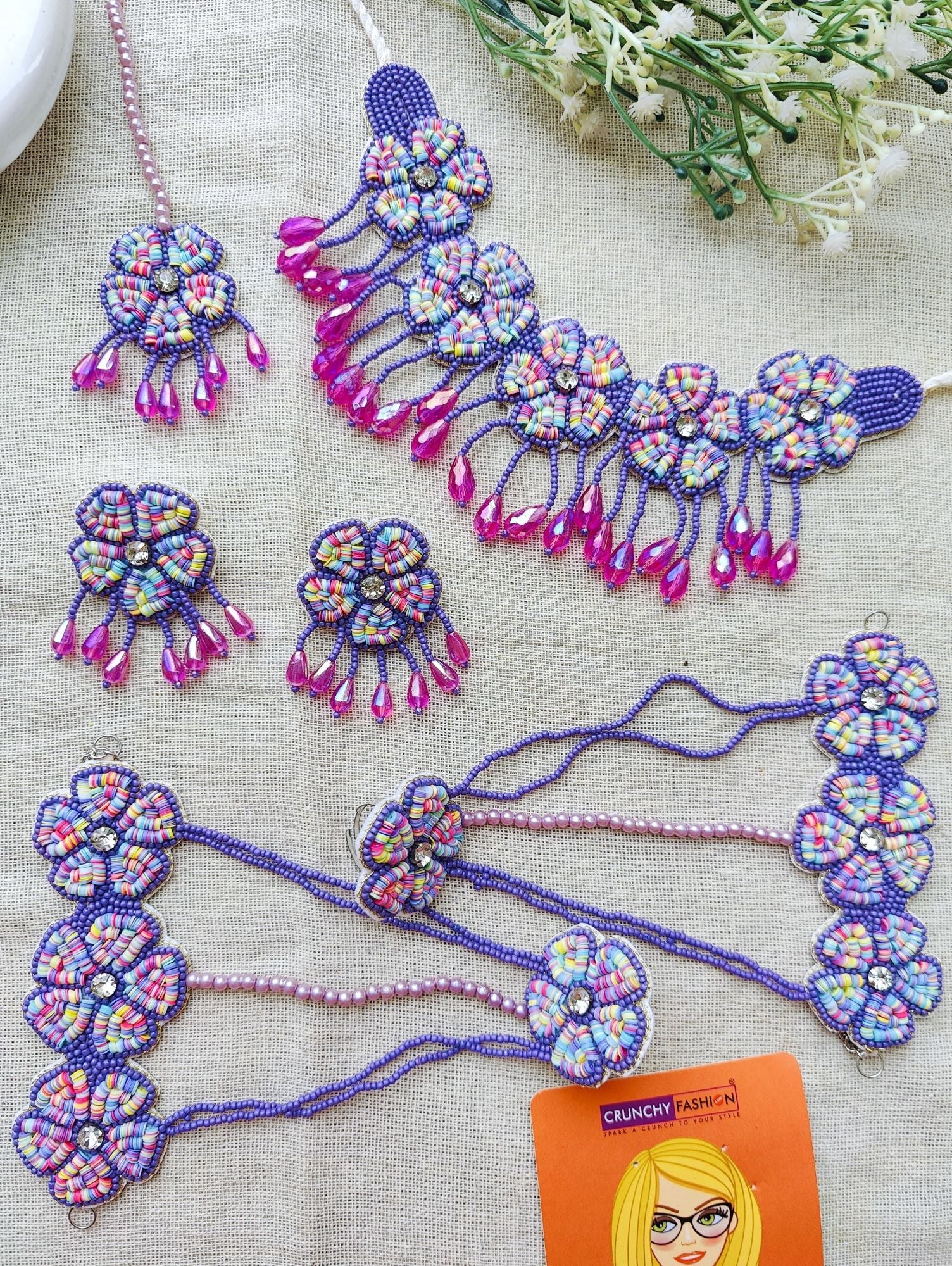 Multicolor handmade jewellery set, ideal for haldi and wedding occasions. Includes mirror work and beaded design, part of the HANDICRAFT collection.