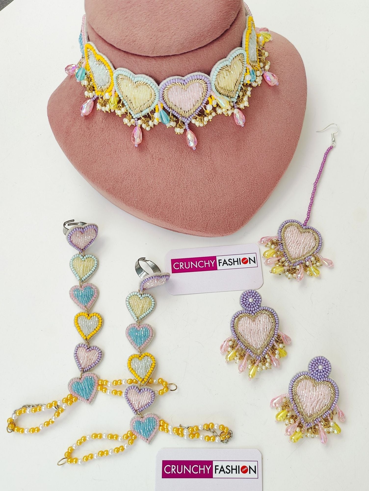 Handmade pastel hearts jewellery set in yellow, green, pink, and lavender for haldi-mehndi, ideal for women