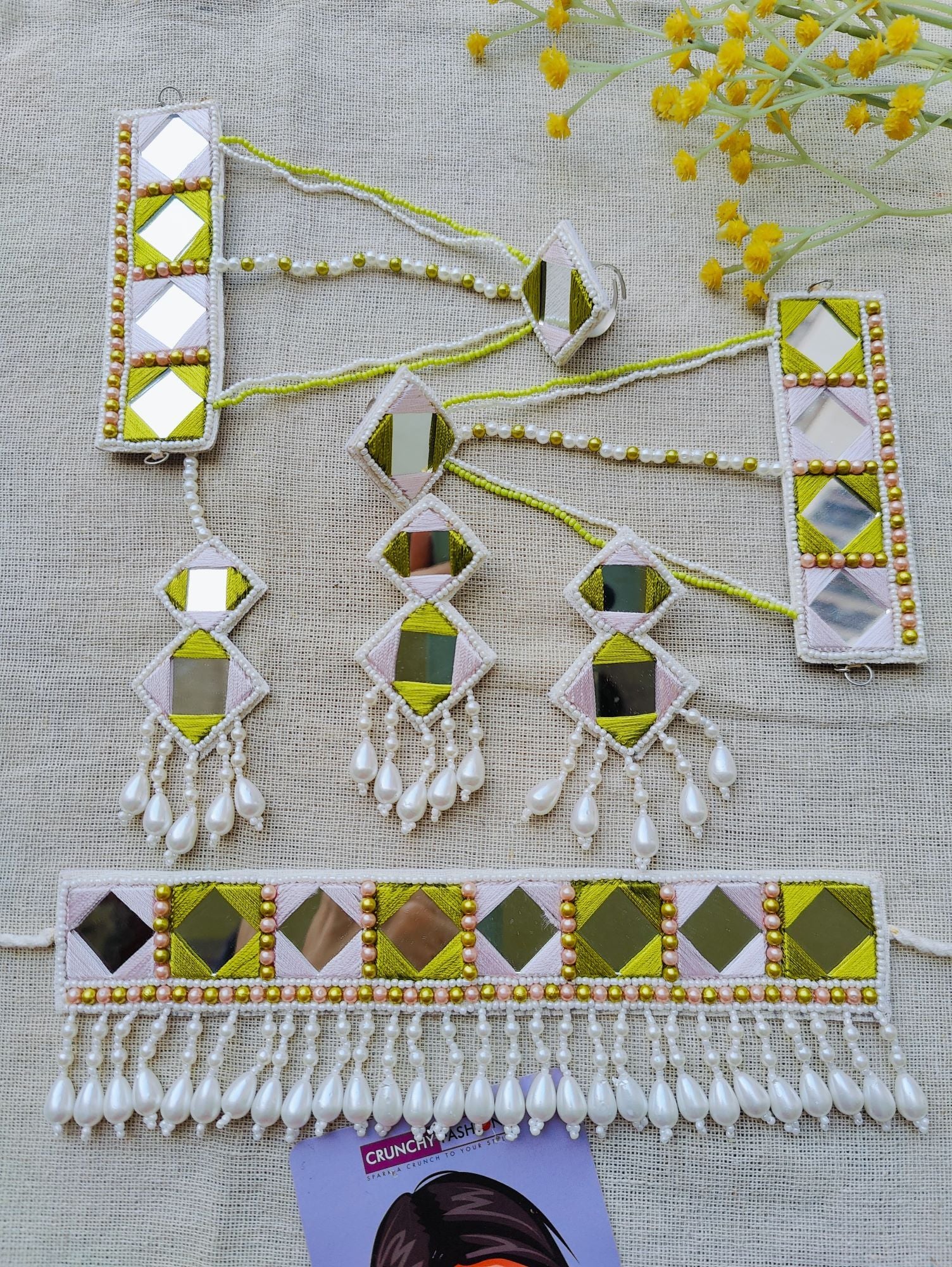 Green and white handmade haldi mehndi jewellery set for bride featuring beaded, pearl and thread materials, ideal for wedding and mehndi occasions.