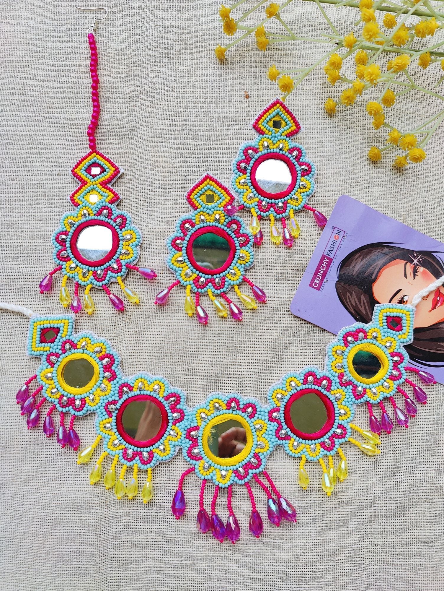 Image of a multicolored, handcrafted bridal jewellery set for women with floral designs. The beaded and pearl set is ideal for wedding, haldi, and mehndi occasions.