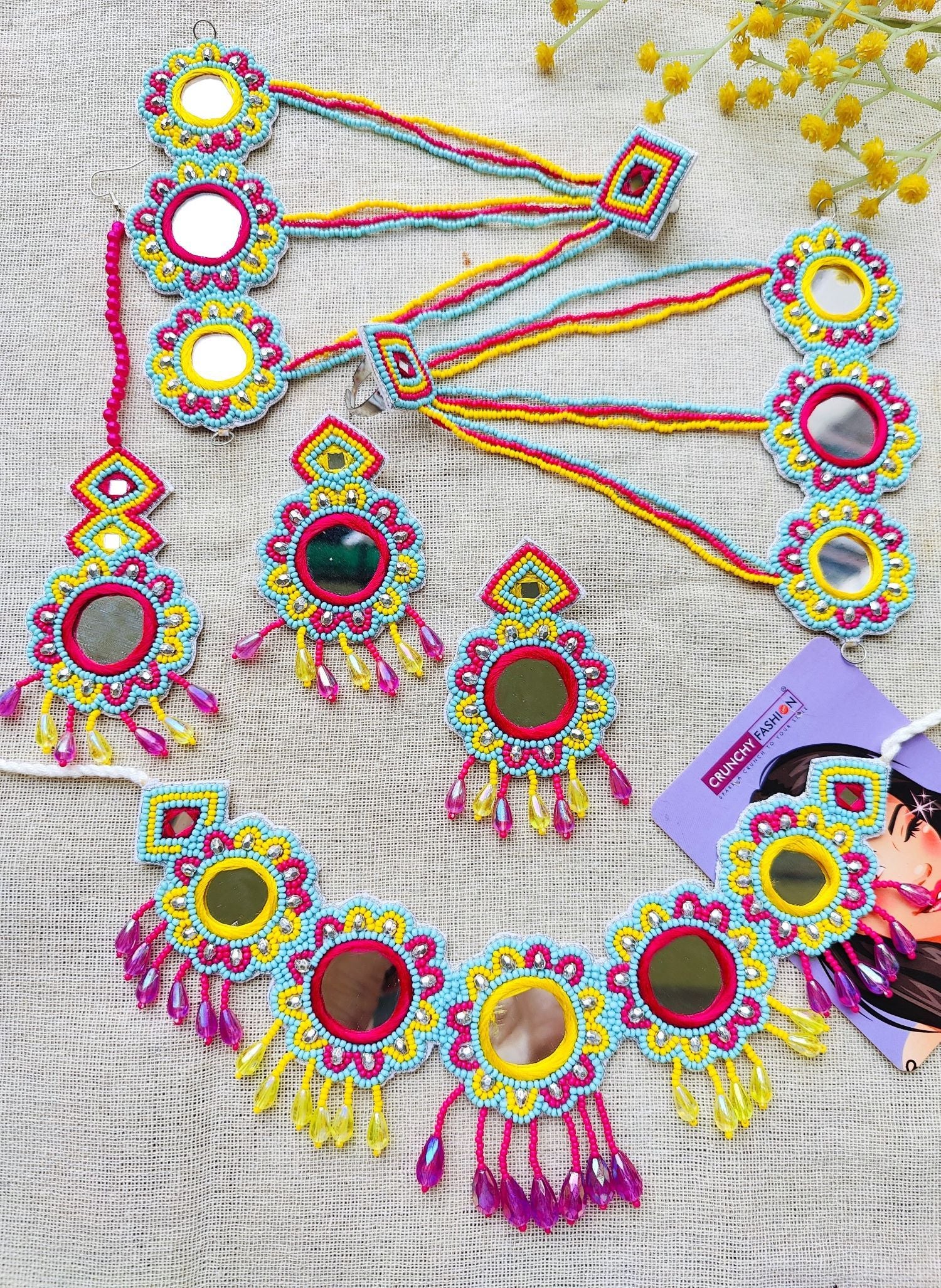 Image of a multicolored, handcrafted bridal jewellery set for women with floral designs. The beaded and pearl set is ideal for wedding, haldi, and mehndi occasions.