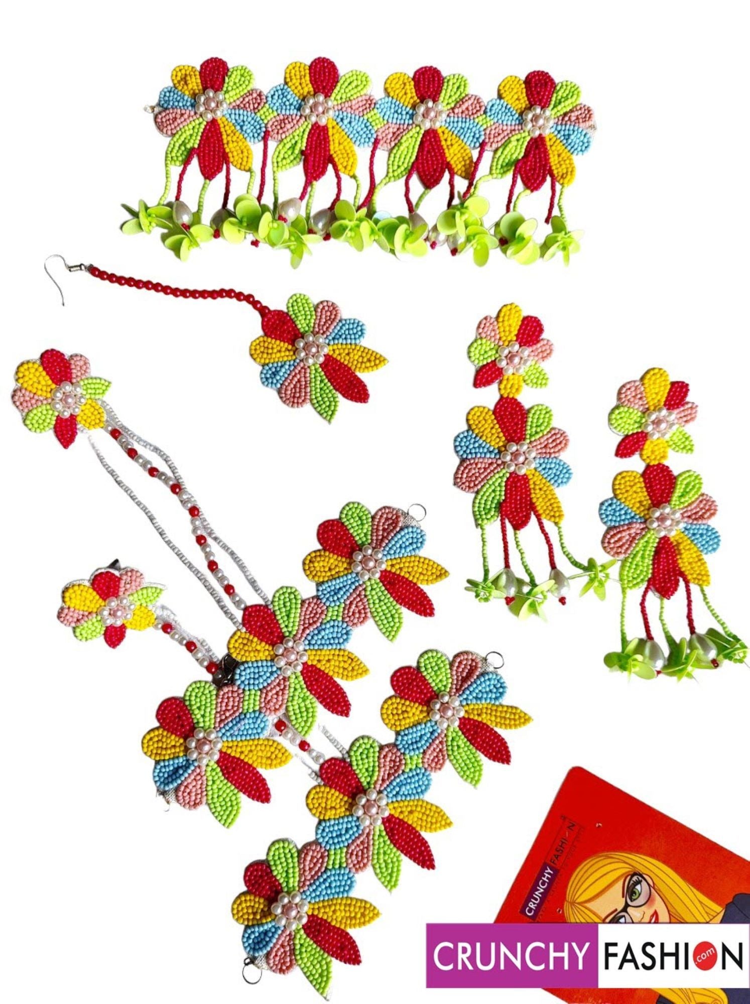 Handcrafted traditional multicolor bridal jewellery set featuring flower-themed beaded and pearl pieces, ideal for women attending weddings, Haldi, or Mehandi ceremonies.