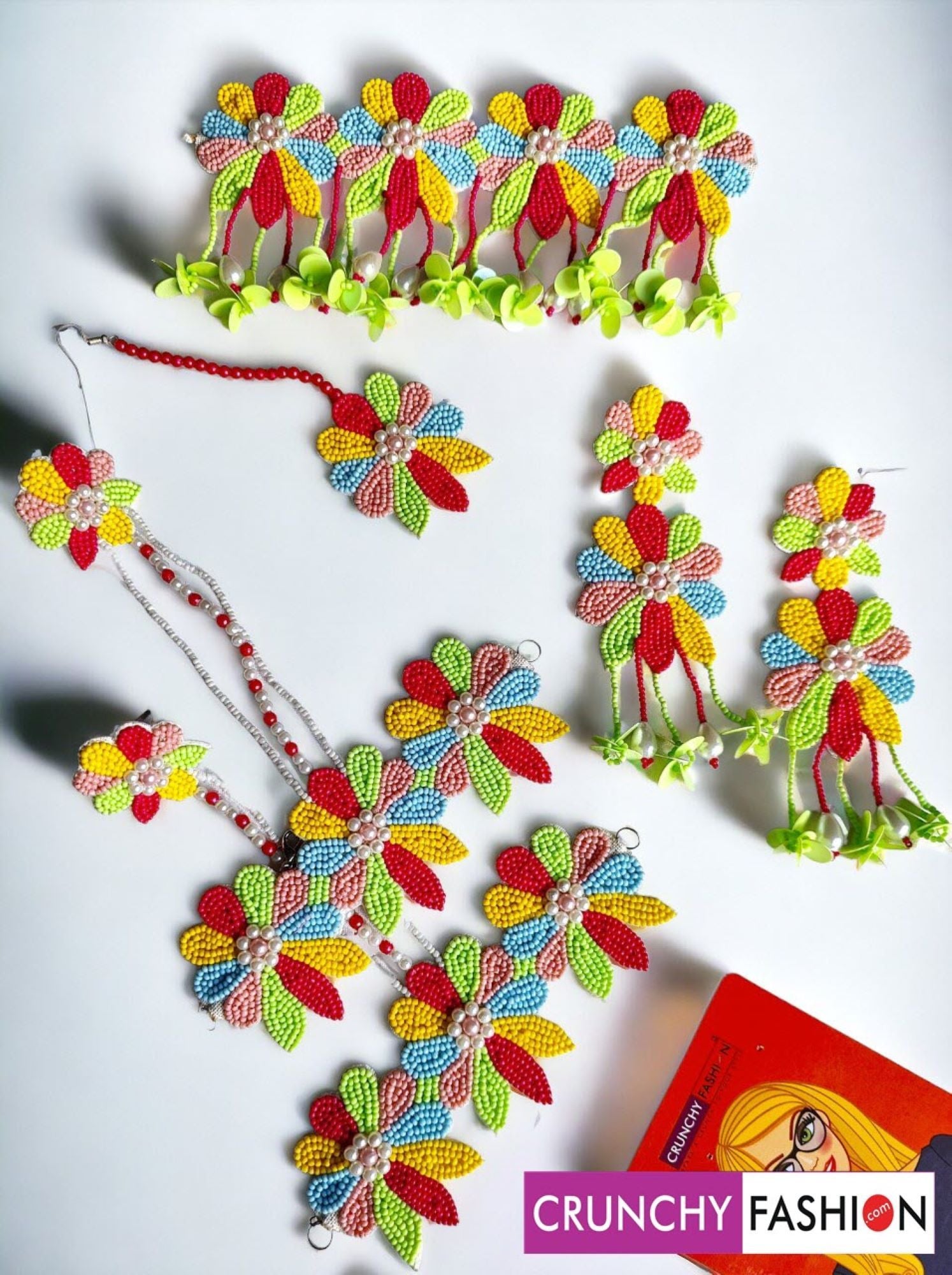 Handcrafted traditional multicolor bridal jewellery set featuring flower-themed beaded and pearl pieces, ideal for women attending weddings, Haldi, or Mehandi ceremonies.