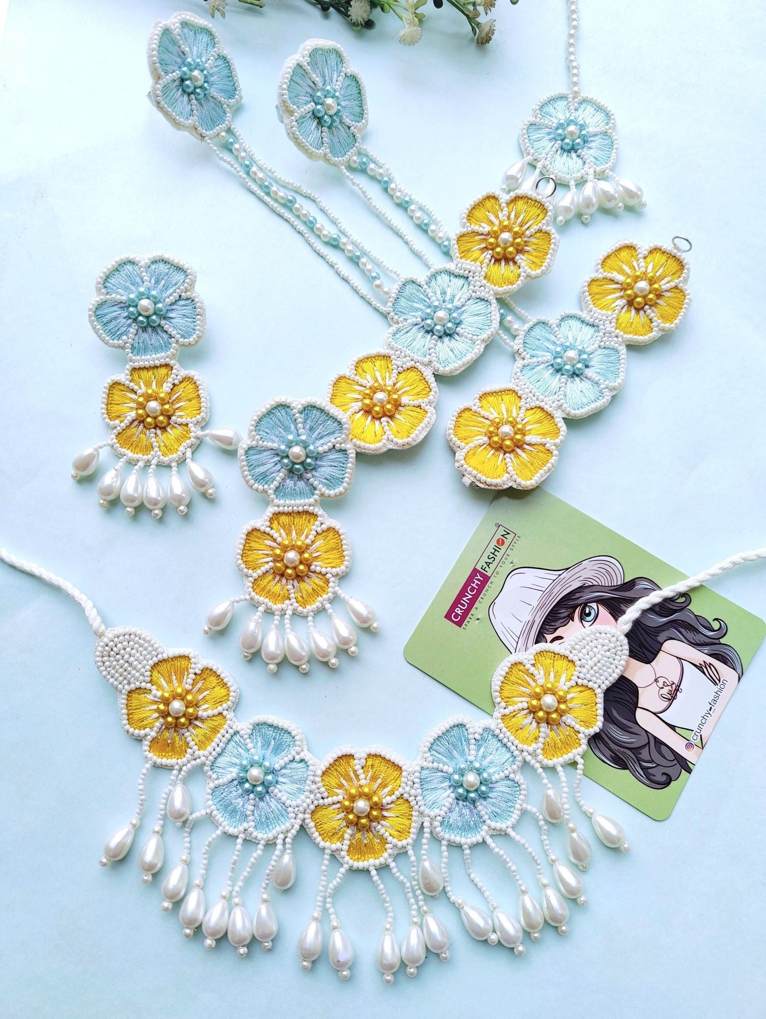 Handmade floral-themed yellow & sky-blue beaded jewellery set for brides' haldi ceremony, with push-back pierced earrings.
