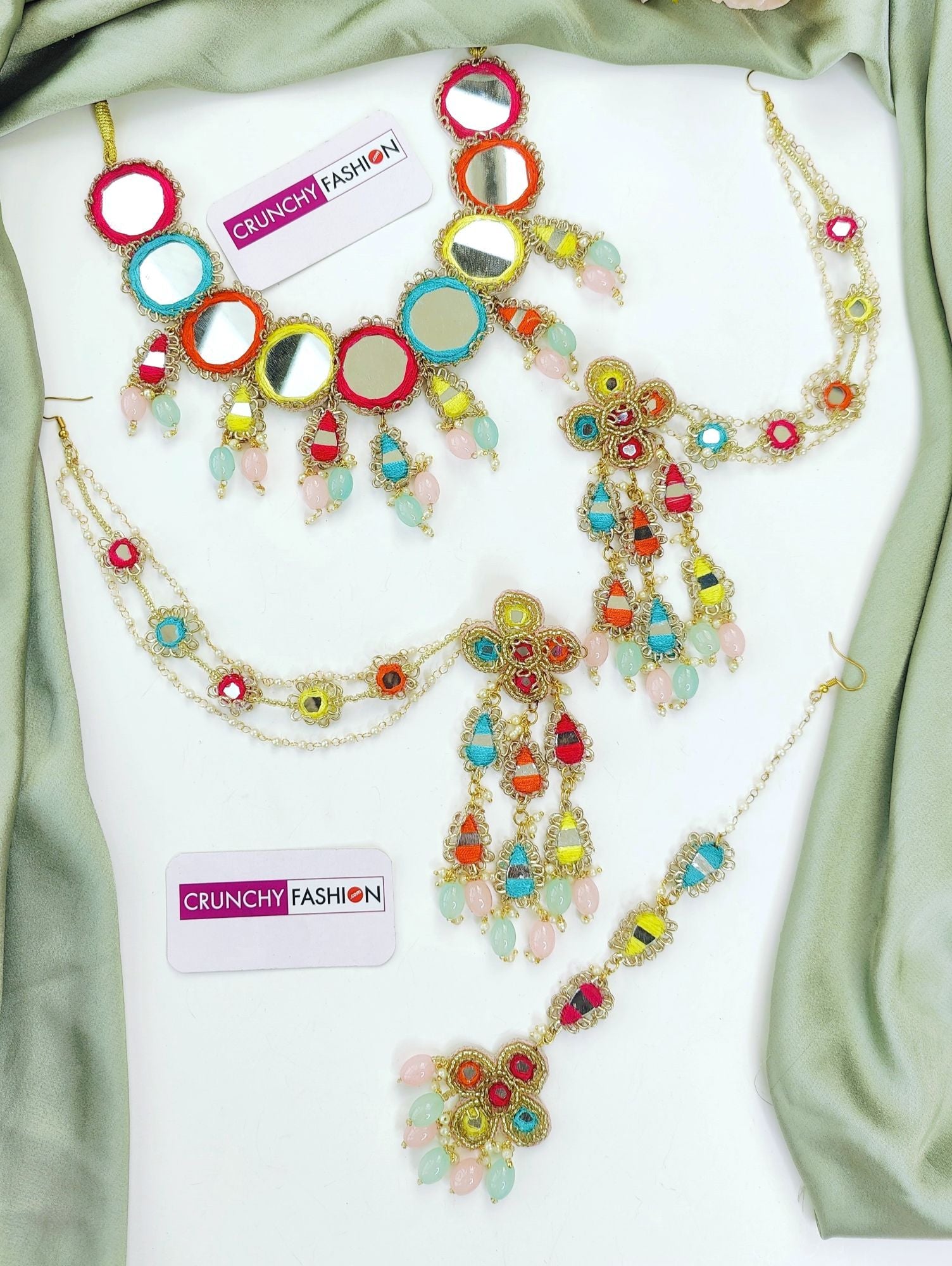 Handmade multicolored bridal jewellery set with mirrorwork and floral details, perfect for haldi-mehndi, weddings.