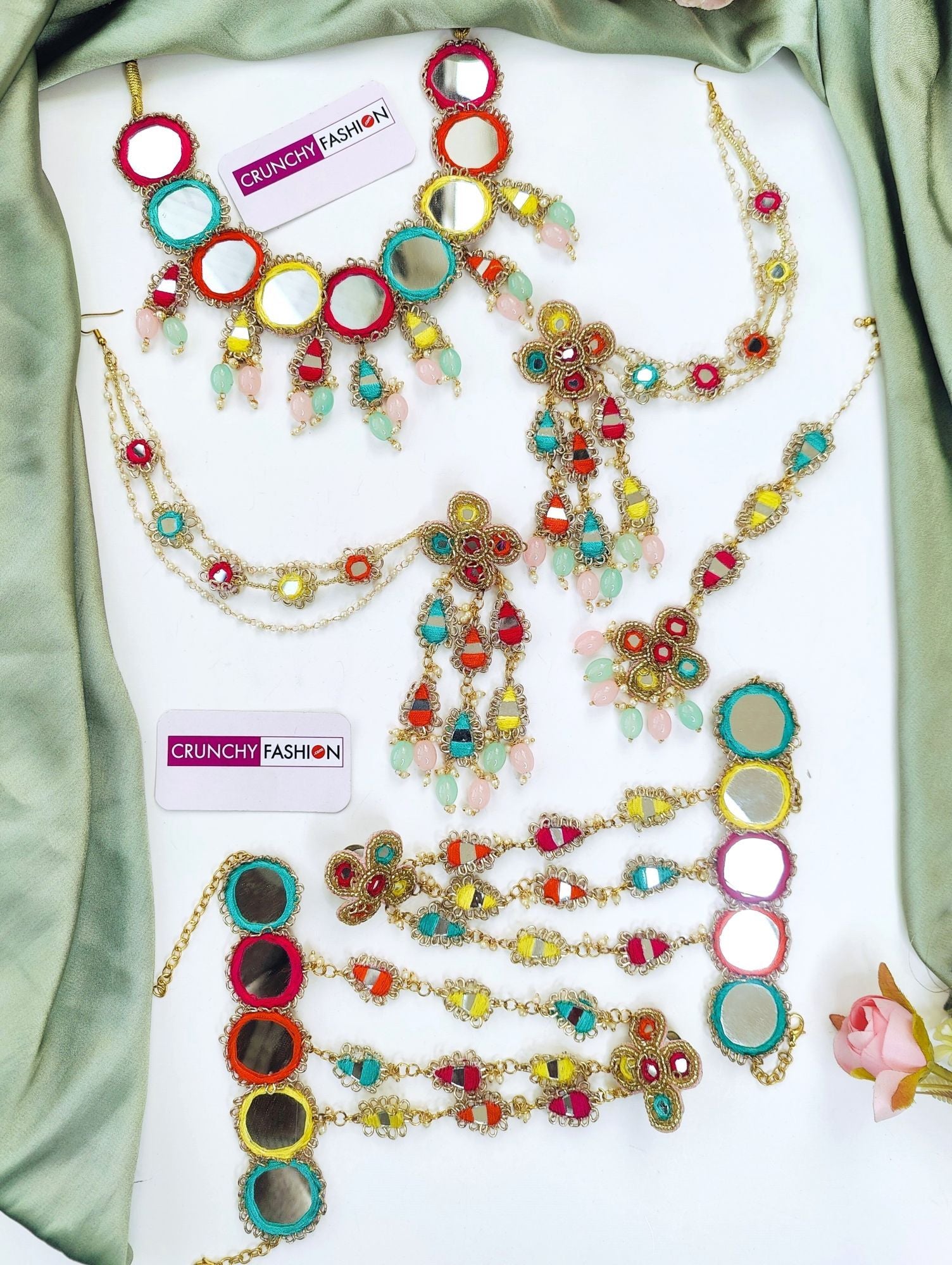 Handmade multicolored bridal jewellery set with mirrorwork and floral details, perfect for haldi-mehndi, weddings.