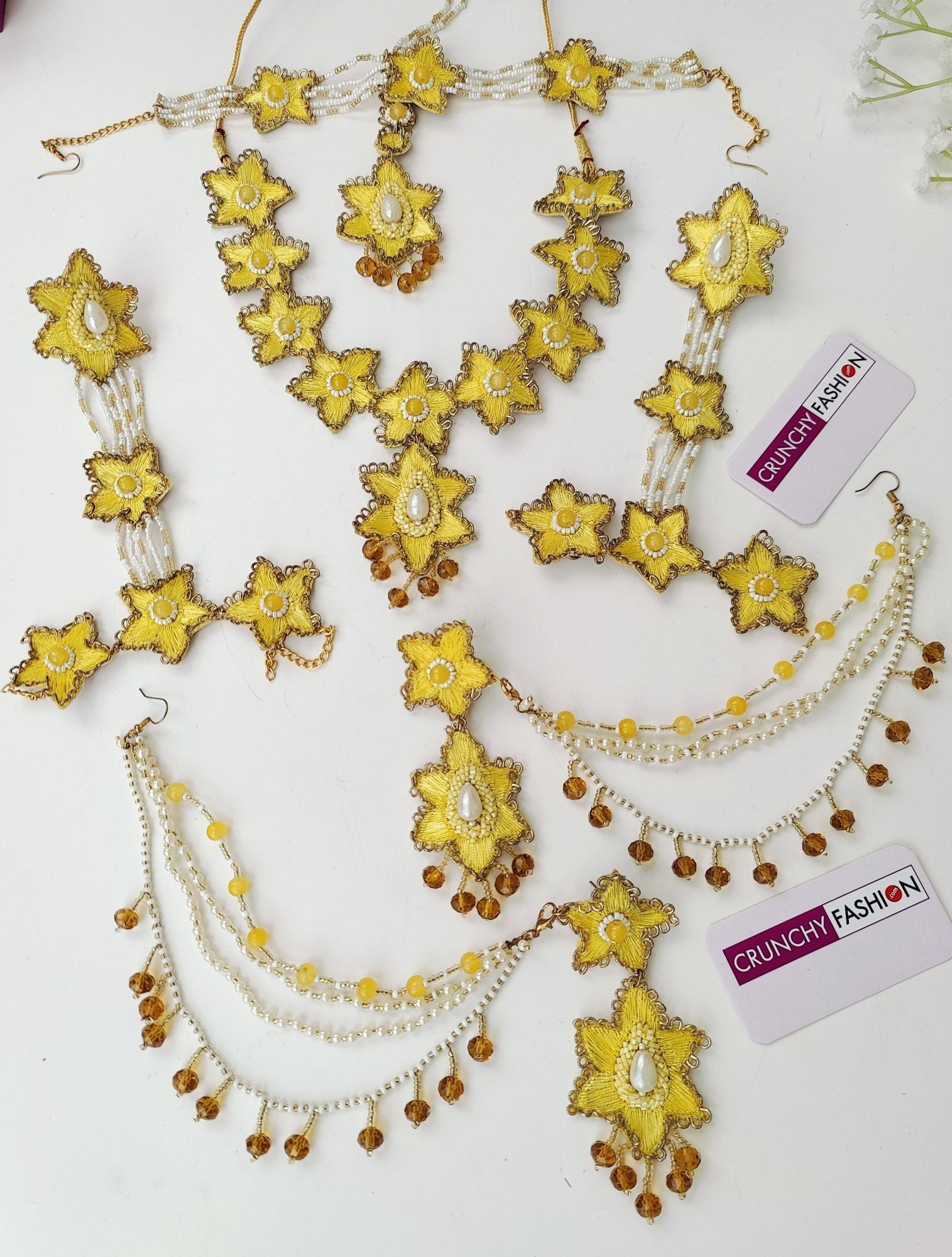 Handcrafted yellow sunflower bridal jewellery set, including necklace, earrings, maang tika and hathphools for haldi ceremony