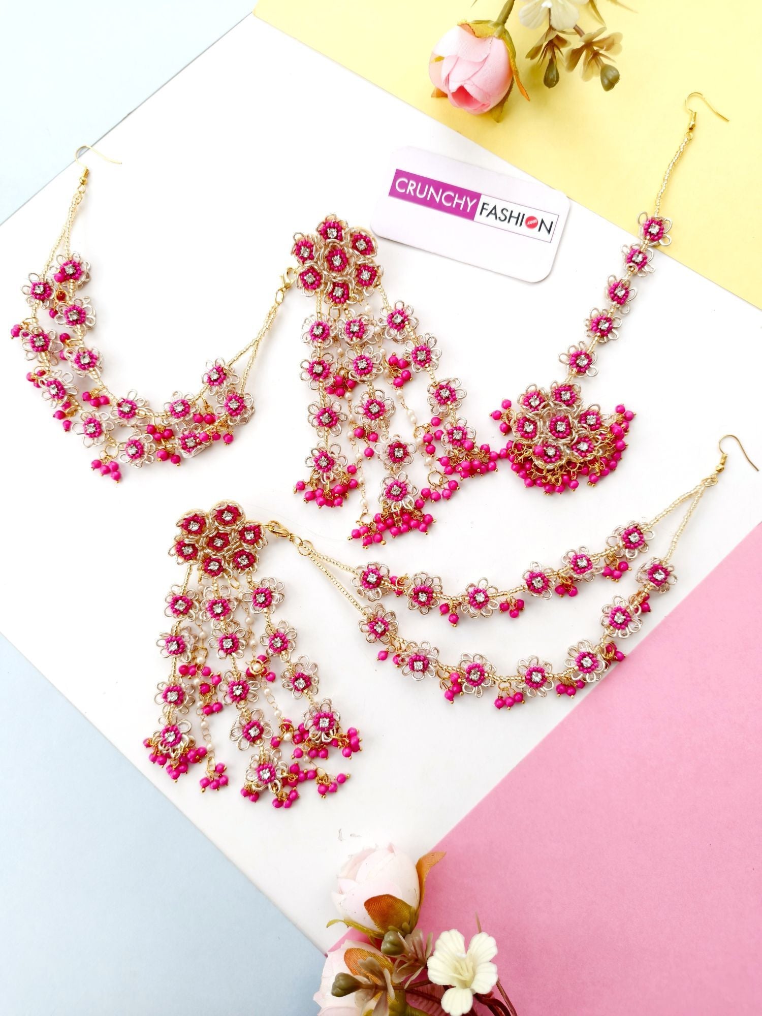 Handmade hot pink floral bridal jewellery set w asym design for haldi-mehndi occasion featuring silver-plated base beads