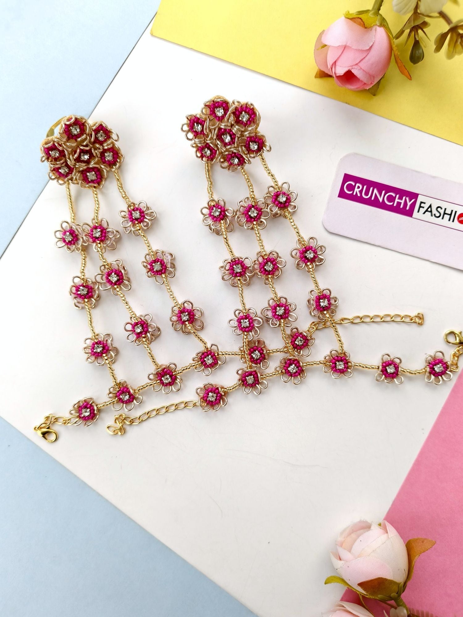 Handmade hot pink floral bridal jewellery set w asym design for haldi-mehndi occasion featuring silver-plated base beads