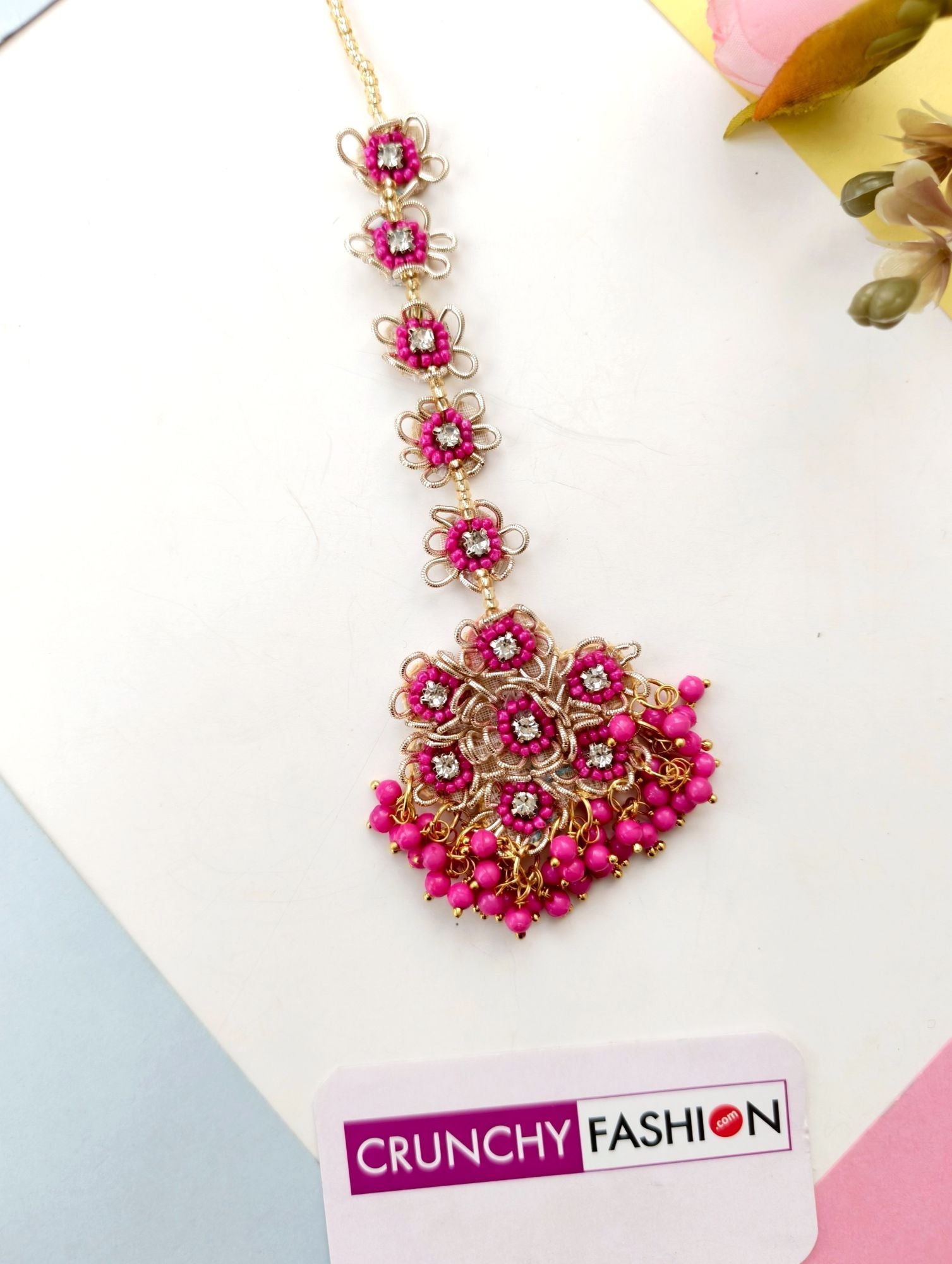 Handmade hot pink floral bridal jewellery set w asym design for haldi-mehndi occasion featuring silver-plated base beads
