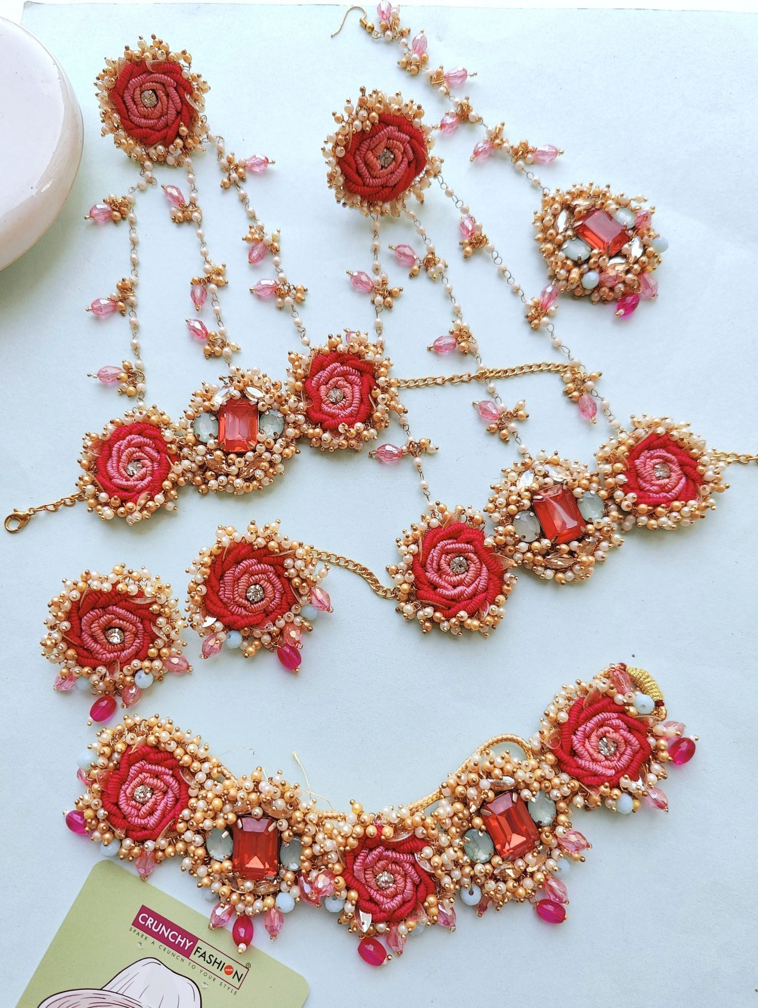 Handmade pink floral beaded jewellery set, ideal for haldi-mehndi, wedding, and festive parties.