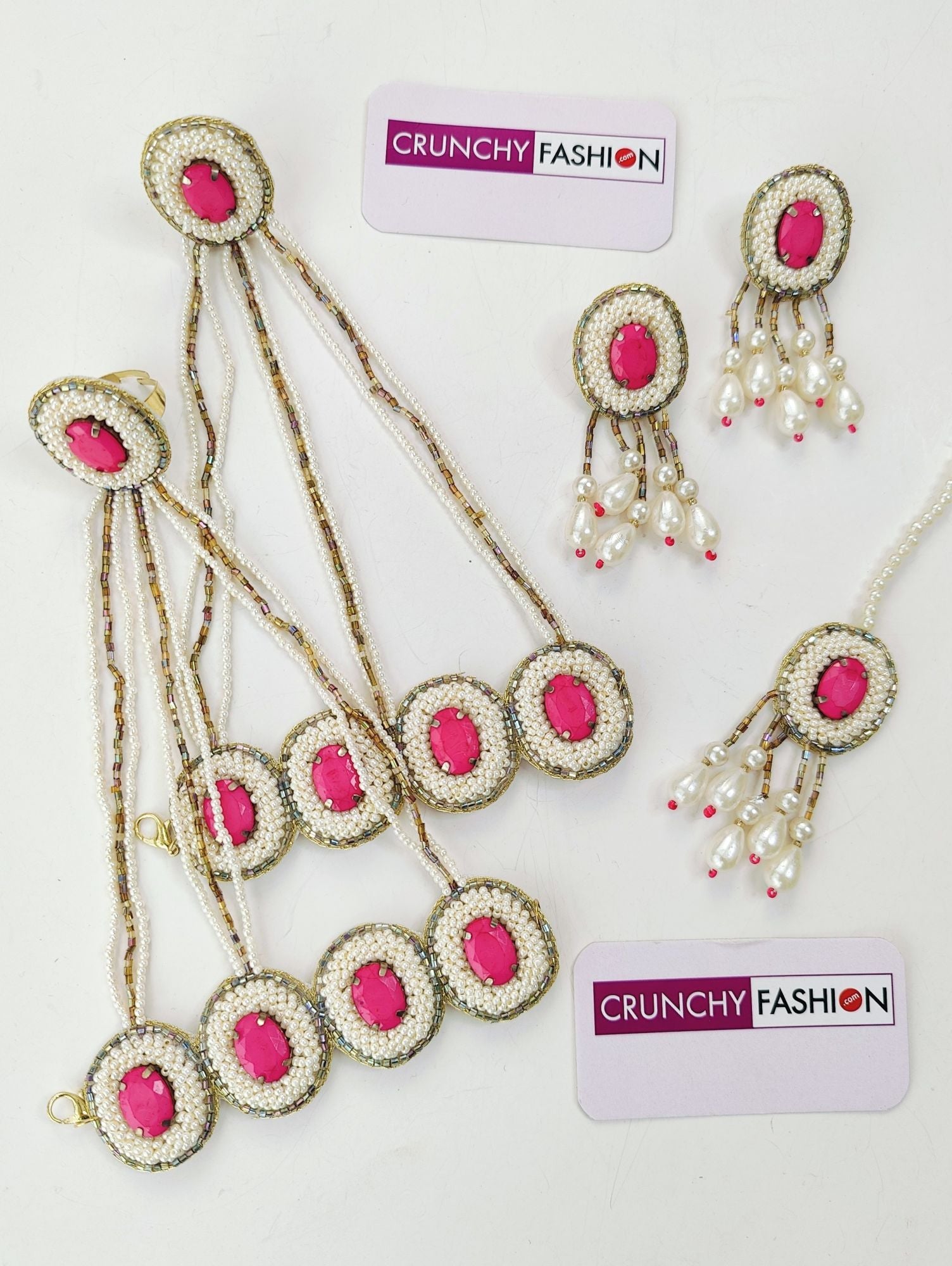 Handcrafted pink crystal pearl bridal jewellery set for haldi-mehndi, including necklace, earrings, maang tika and hathhools
