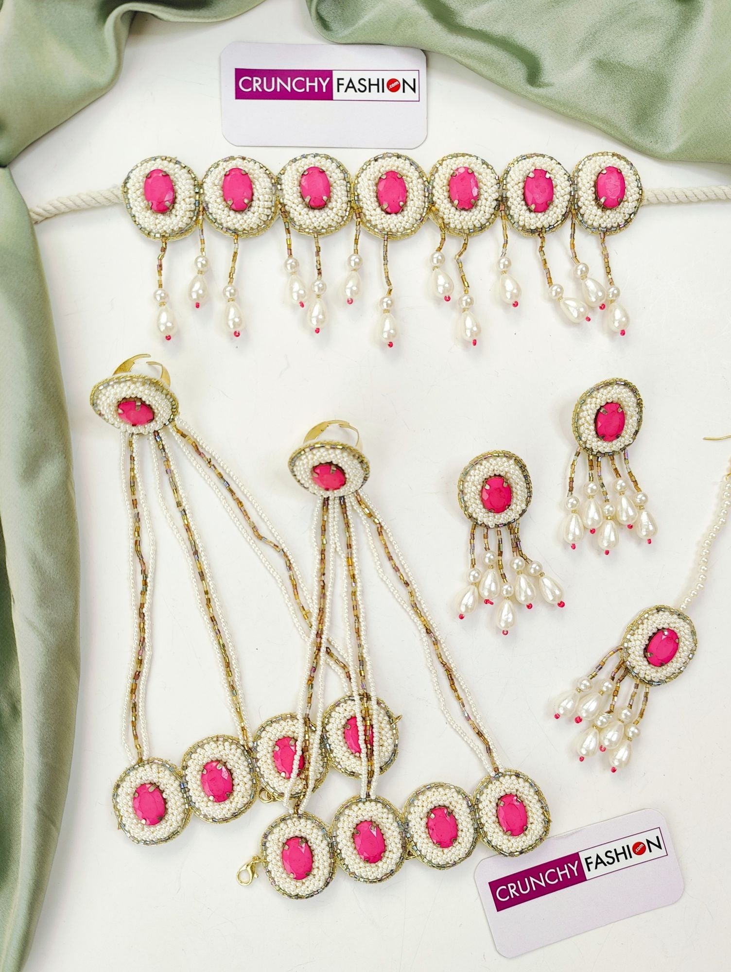 Handcrafted pink crystal pearl bridal jewellery set for haldi-mehndi, including necklace, earrings, maang tika and hathhools